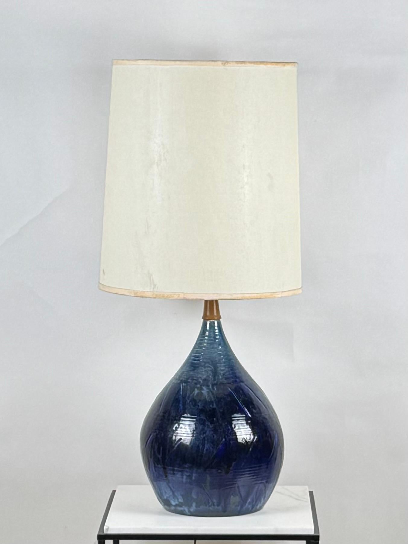 Large whimsical glazed ceramic teardrop lamp with original shade.

The dimensions listed are the overall dimensions of the lamp base with the shade. The base alone is 14 in. diameter x 22 in. tall.