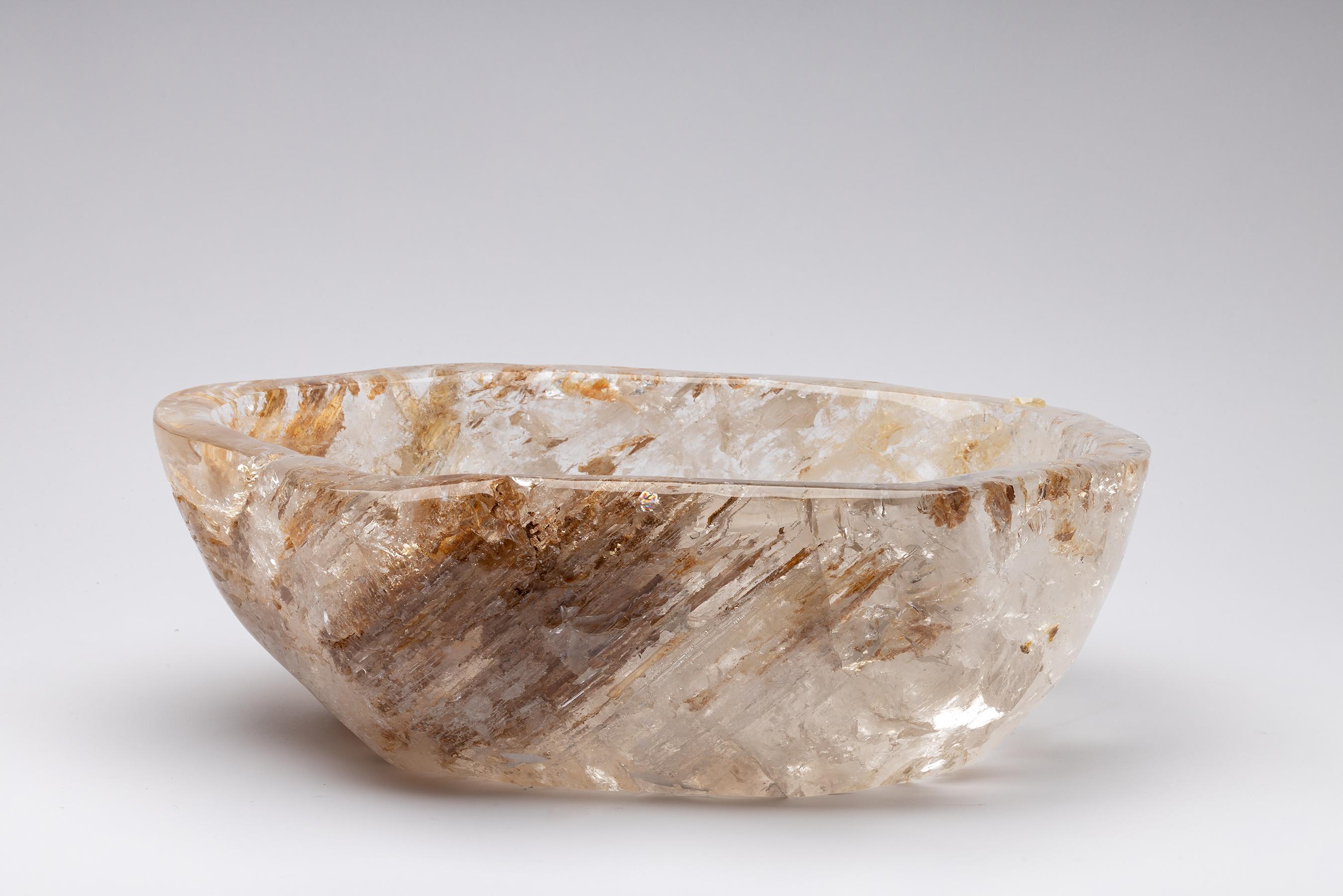 Large white Brazilian quartz with oxide inclusions bowl in organic shape.