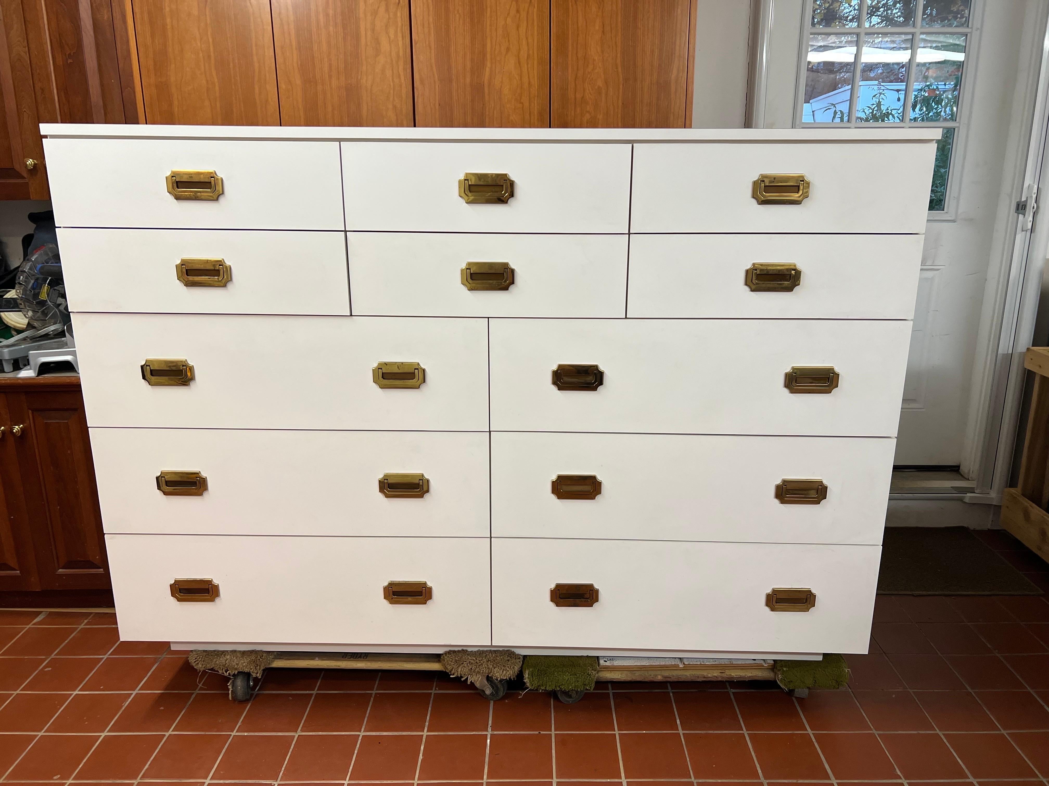 Large White Post modern Campaign Dresser. Perfect piece for that walk in closet. This is the ultimate storage piece. It can hold so much. Two rows of thinner drawers almost 5