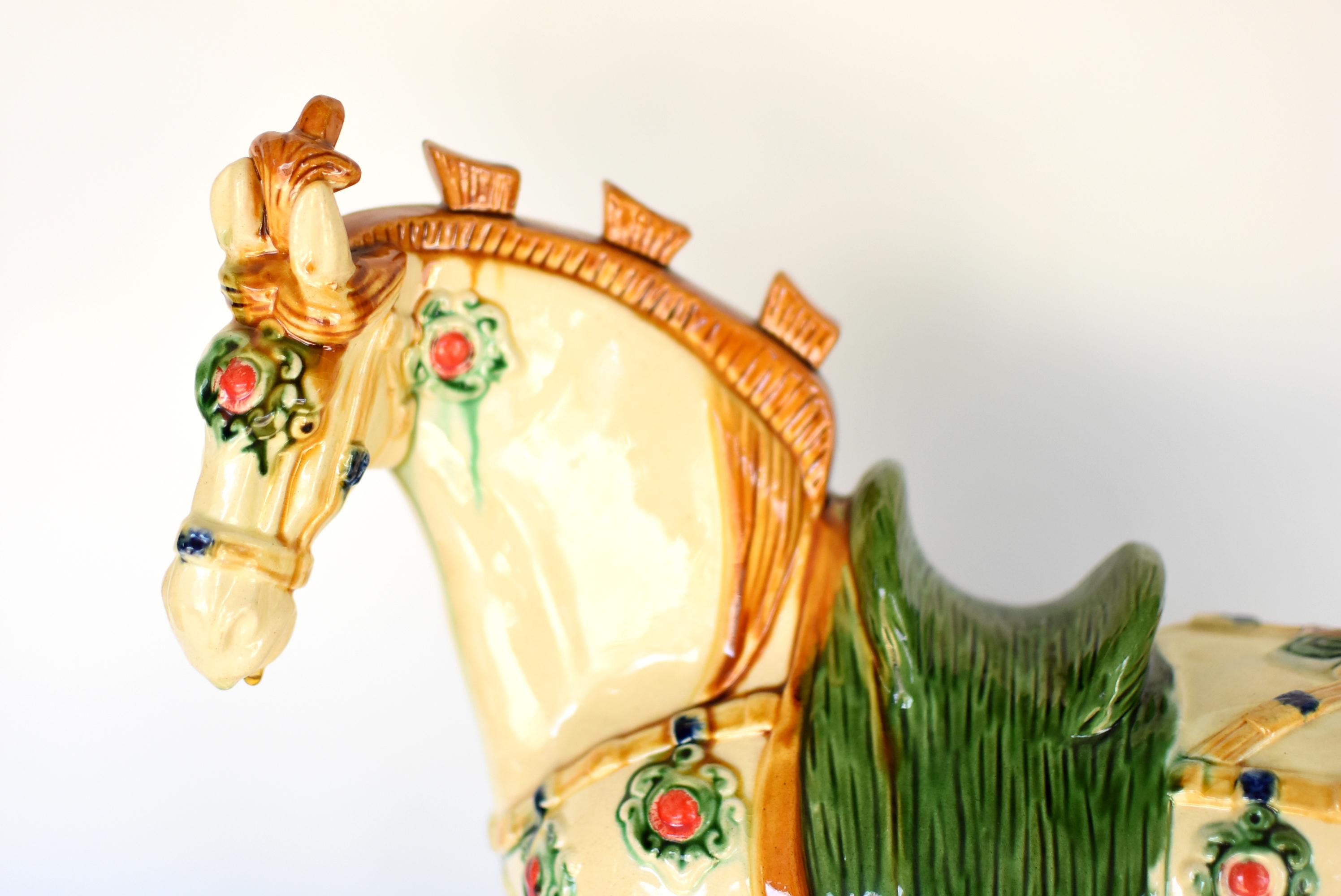 A majestic, large, white butterscotch San Cai horse in high gloss. The Sancai technique dates back to the Tang dynasty (618–907AD). This wonderful piece has all the hallmarks of Tang San Cai terracotta potteries with skillfully applied glaze
