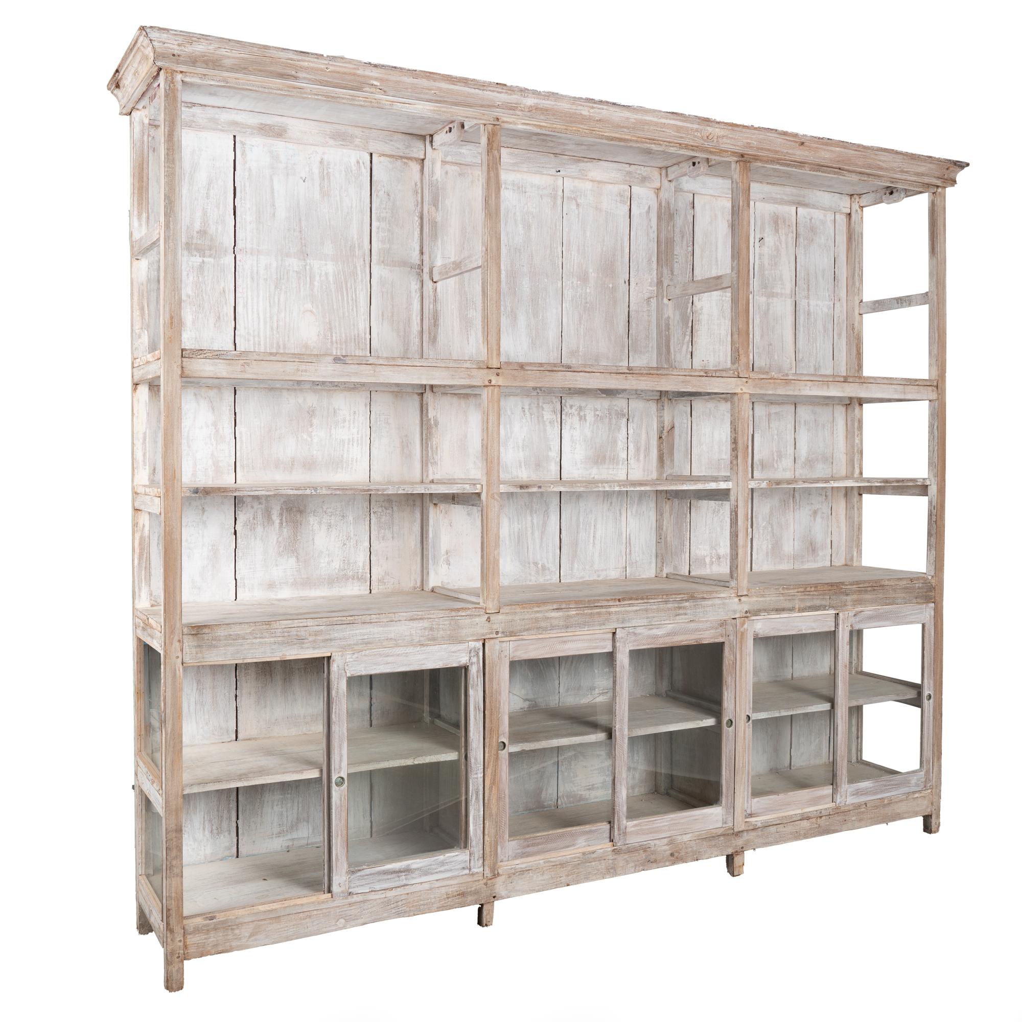 Large vintage display cabinet or bookcase with open shelving above and six sliding glass doors below. White washed painted finish.
Shelf depth of upper/open section:
Top and Bottom Shelves are 17.5