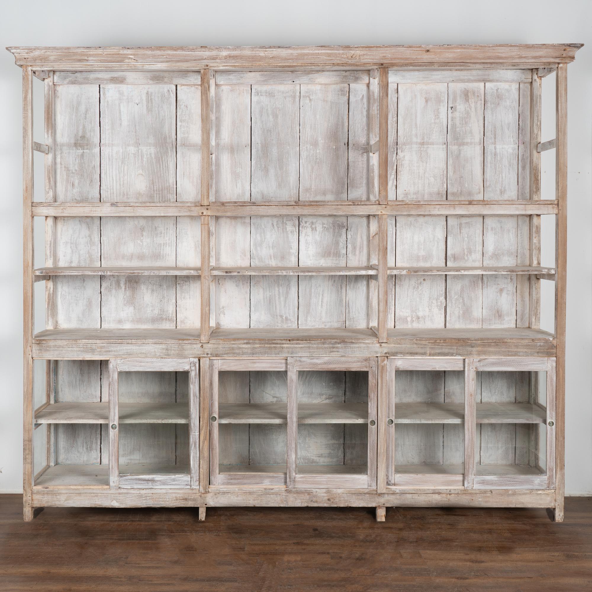 white bookcase with glass doors