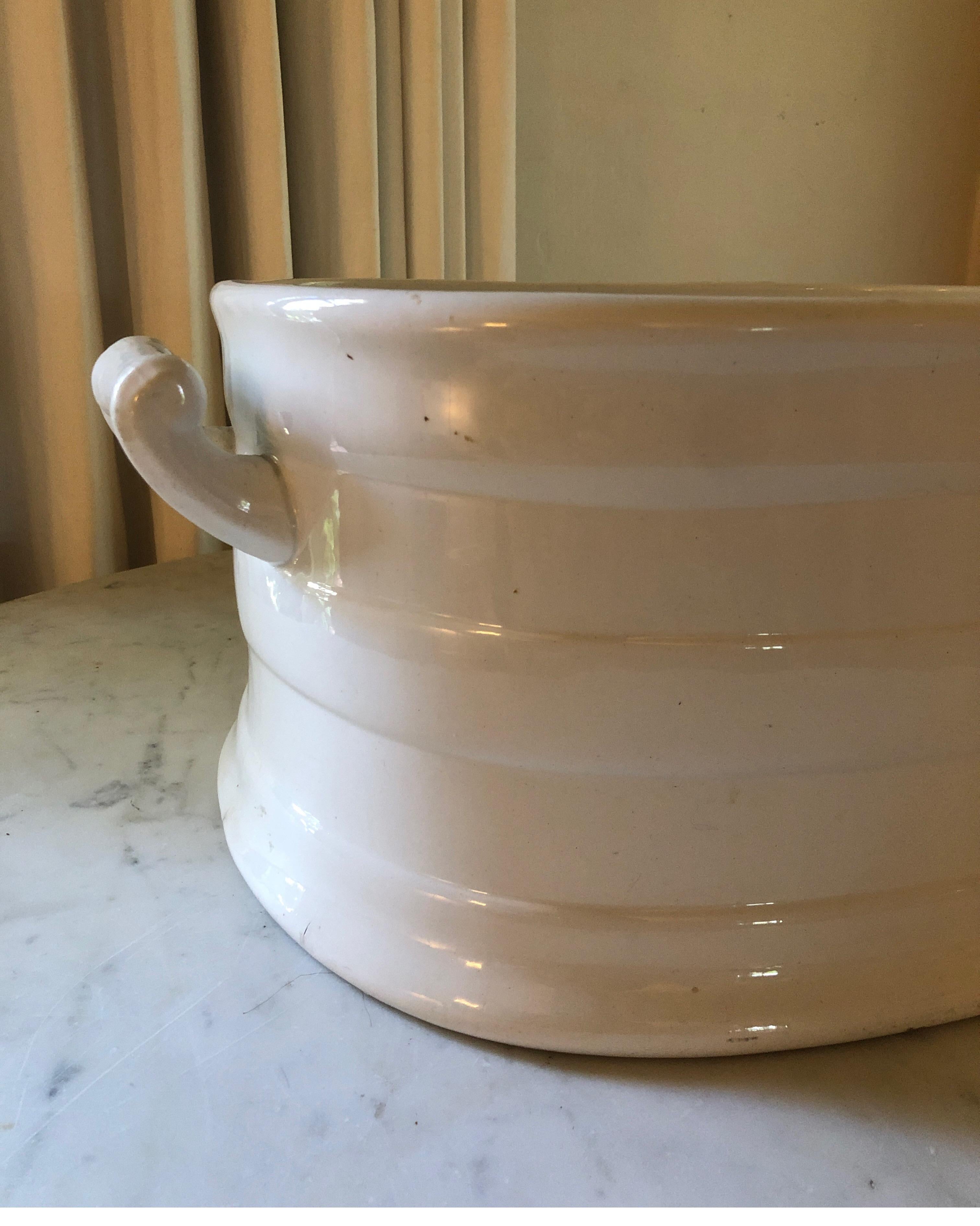 Large piece in overall good condition. Solid white with handles. 
Porcelain has a few areas of crazing. No leaks or breaks. One small chip (see pics)
Great as a planter, champagne ice bucket/white wine cooler. 

Perfect for holiday gatherings.