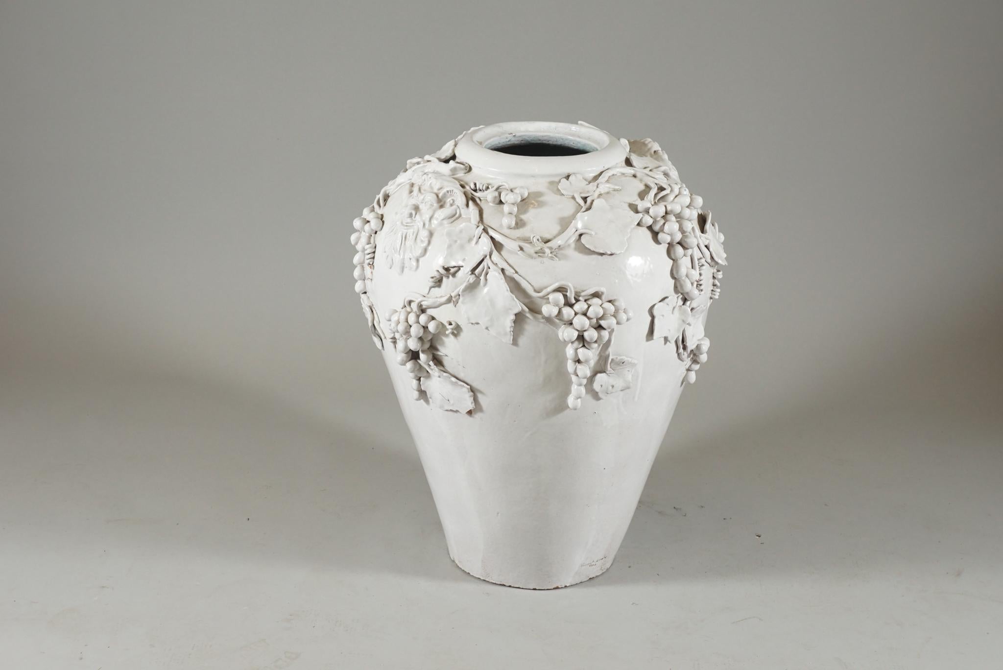 Exquisite white glazed Jar with masks and grapevine motifs. Signed Vincent Garnier: France.