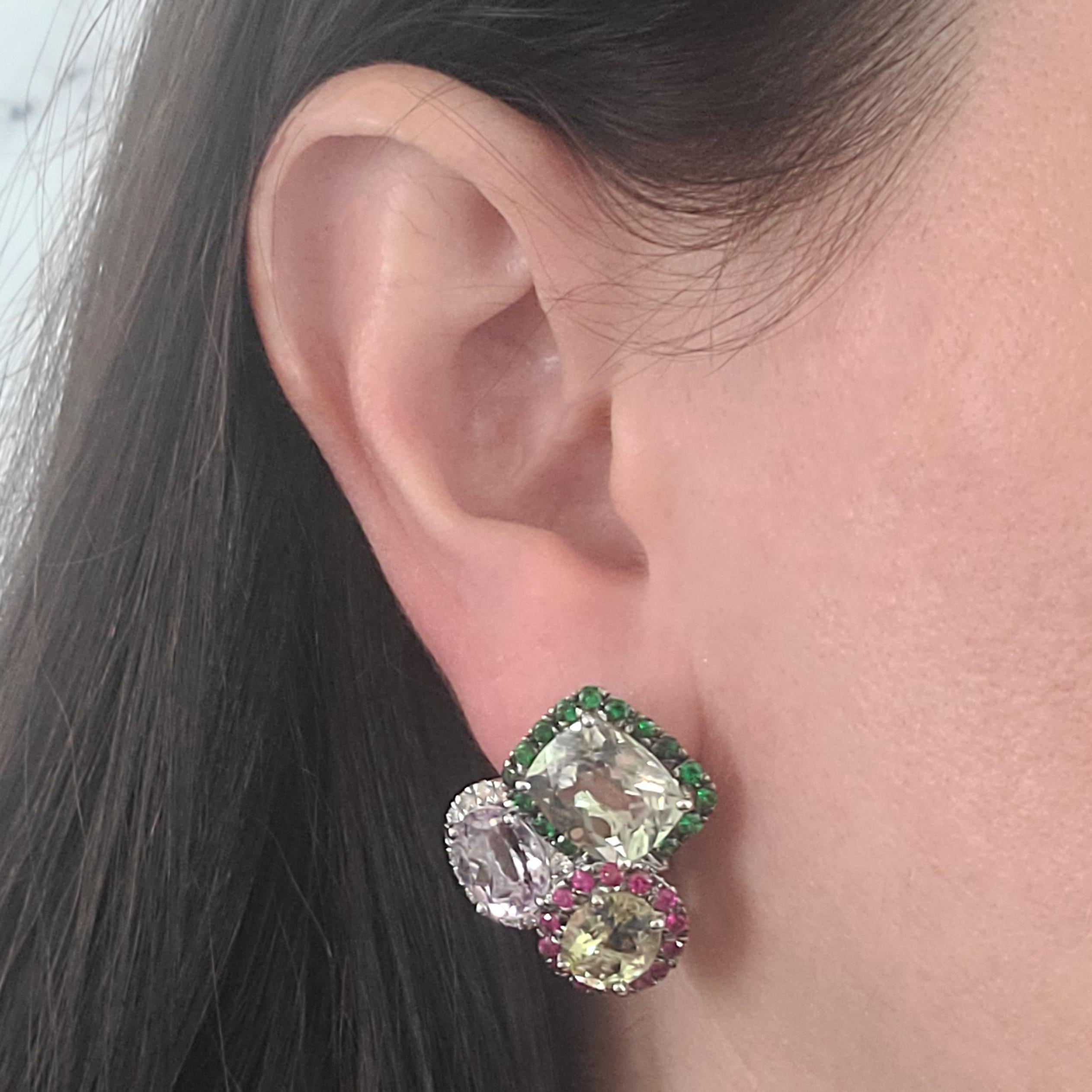 18 Karat White Gold Multicolor Gemstone Earrings Featuring Amethyst, Lemon Citrine, & Prasiolite Totaling Approximately 20 Carats Accented By Diamonds, Rubies, & Tsavorite Garnets Totaling An Additional 3 Carats. Omega Clip Back With Hinged Post.