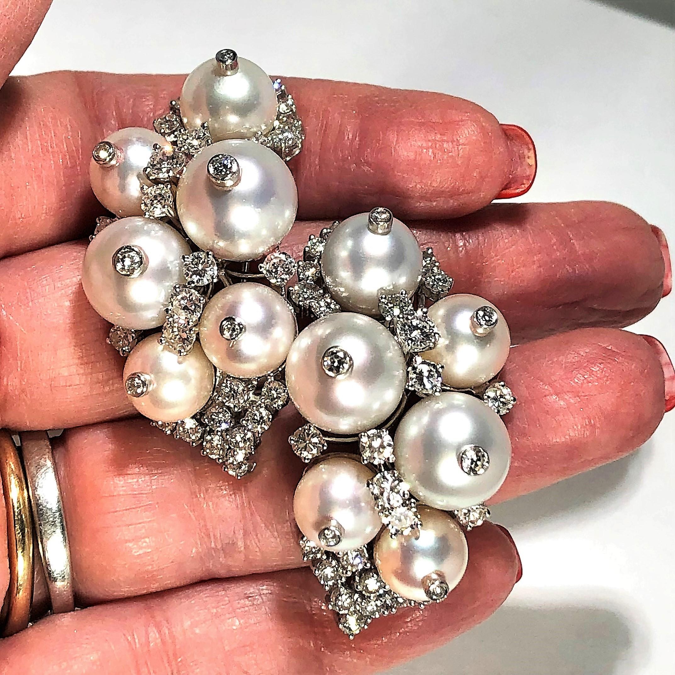 Fashioned in 18K White Gold with assorted cultured pearls 
ranging in size from 8.5mm-11mm and with round brilliant
cut diamonds weighing an approximate total of 4.92CT of
overall G Color and VS1 Clarity. These amazing earrings
have  fold down posts