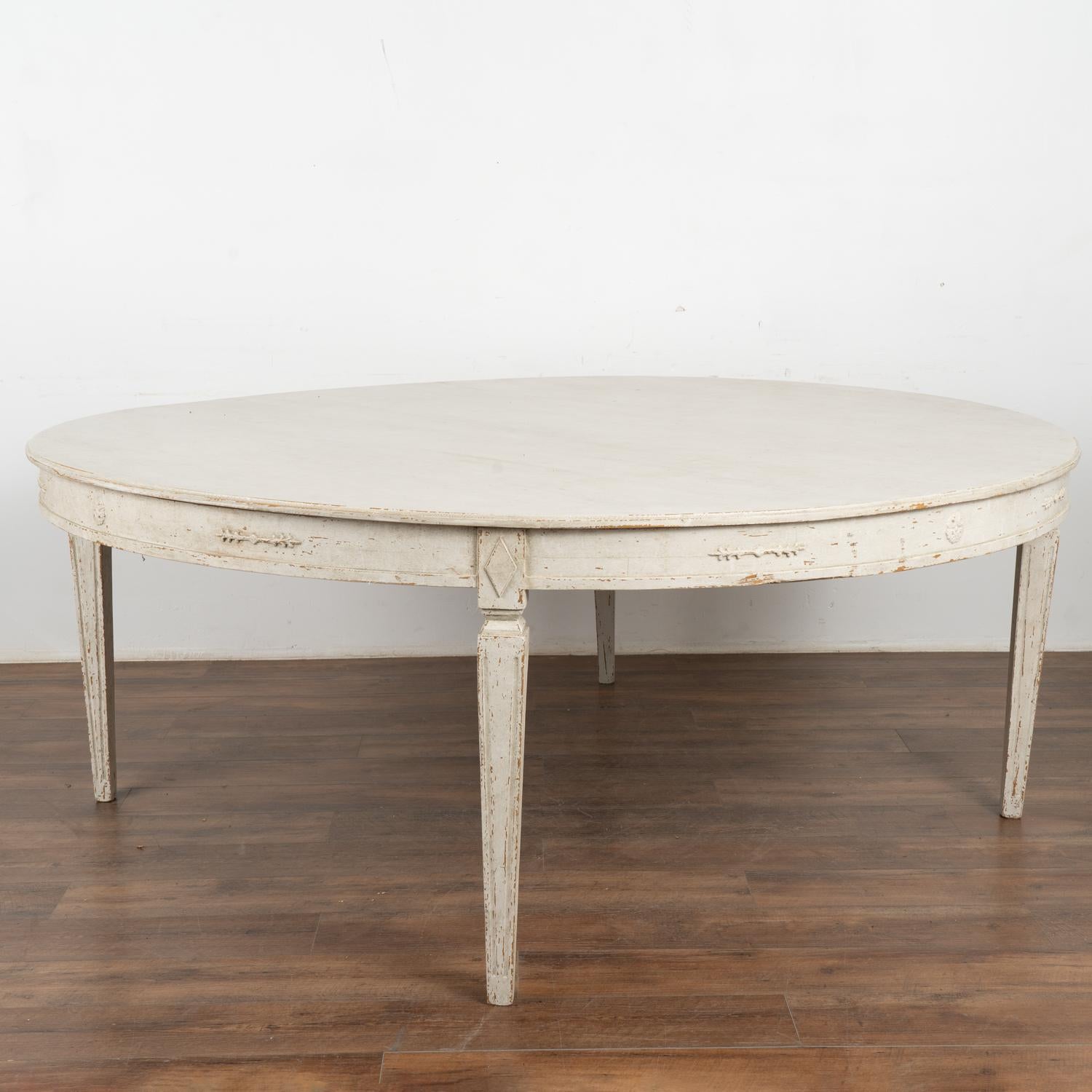 Round dining table, 6.5' diameter with the look of the Gustavian style.
This size table did not exist in the gustavian period; this new table mirrors the Swedish style in a larger size suited for today's modern home.
Lovely tapered fluted legs,