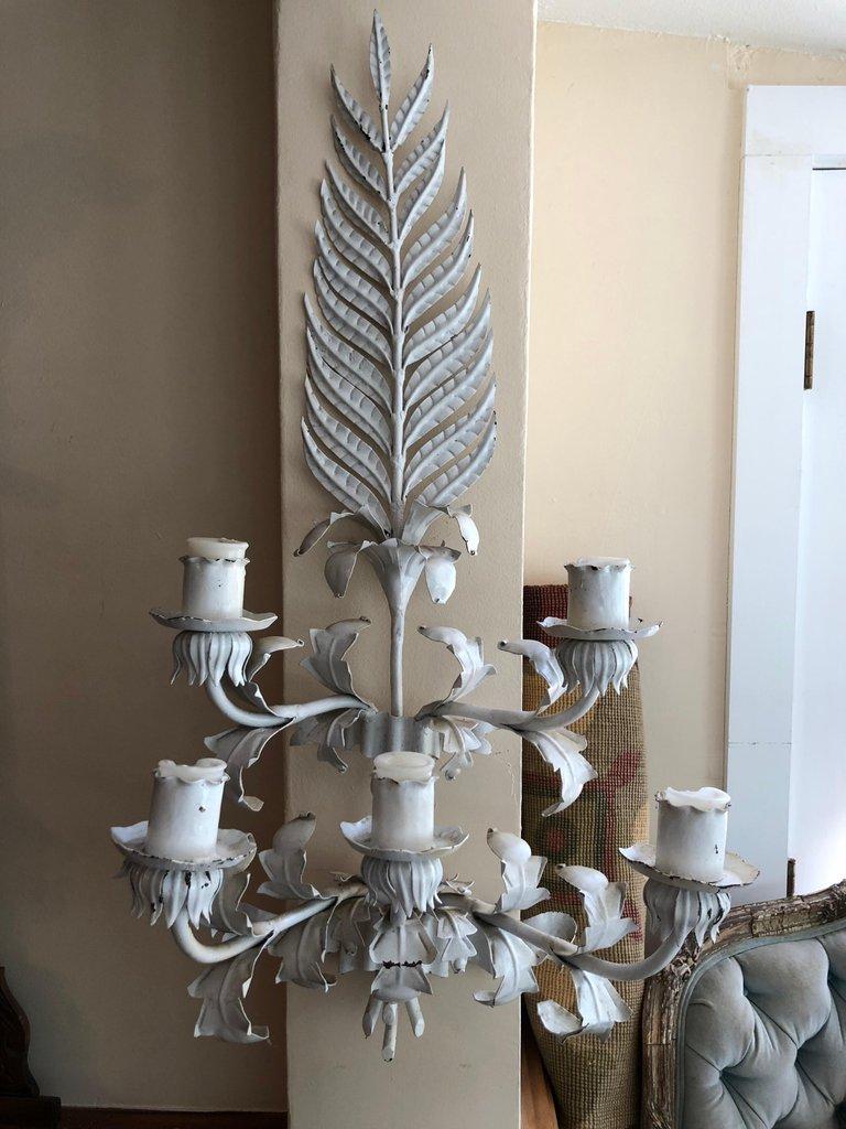 Large white Hollywood Regency iron wall sconce. This stunning wall sconce would pop against any bright busy wallpaper. Very West Palm Beach in style. Designed for candles but could be hardwired. Please request a parcel shipping quote for a more