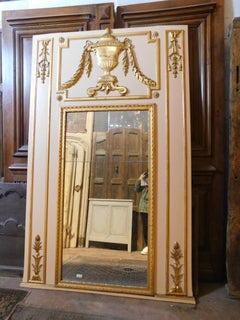 Large white lacquered wooden mirror with golden decorations, very high, France