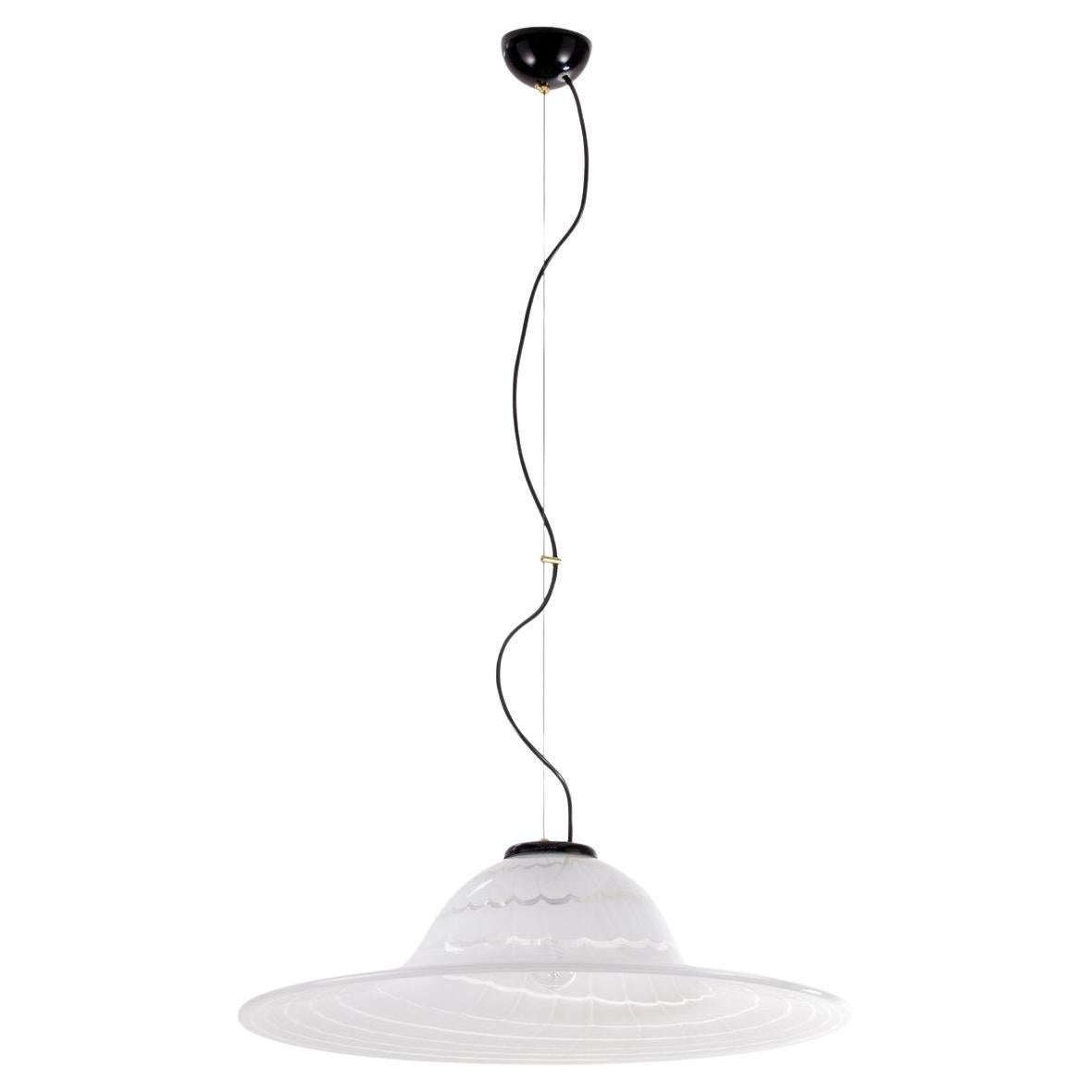 Beautiful vintage Murano glass pendant lamp made in Italy in the 70s. The large size of the blown glass (over 60 cm in diameter!), the elegant shape and the refined workmanship of the spiral filigree make the lamp a unique and valuable piece that