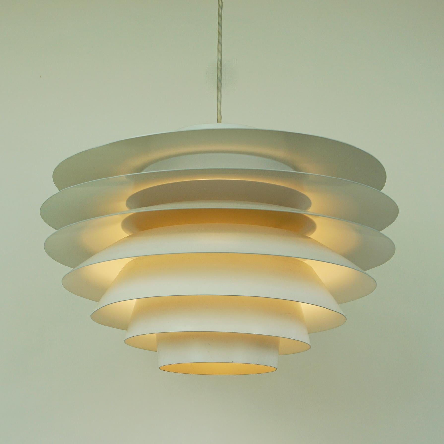 Fantastic large white lacquered Svend Middelboe pendant. Model Verona, number 42029. This pendant light is produced by Nordisk Solar in Denmark. The lamp has a partly gray interior and accommodates maximum 300 watt bulbs. Constructed from tiers of