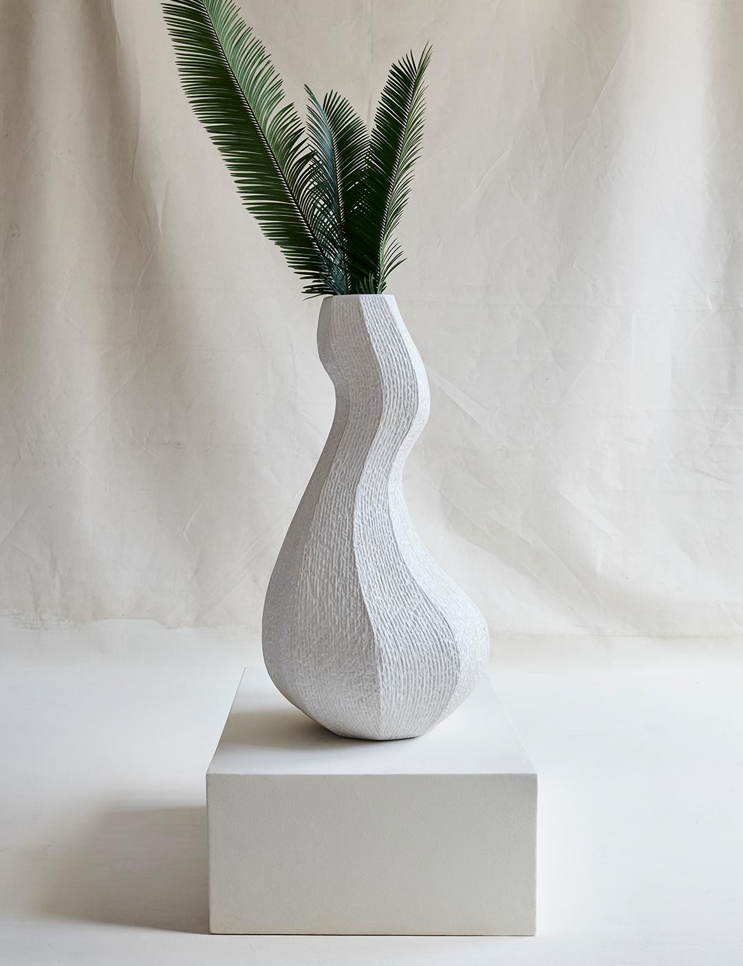 A very large sculptural vessel that brings grandeur to any space it occupies, noted for its organic architecture, striking curves, and natural texture. 

For indoor or outdoor use.

18.7” W x 35.4” H x 18.7” D
47.5 W x 90 H x 47.5 D cm
Material: