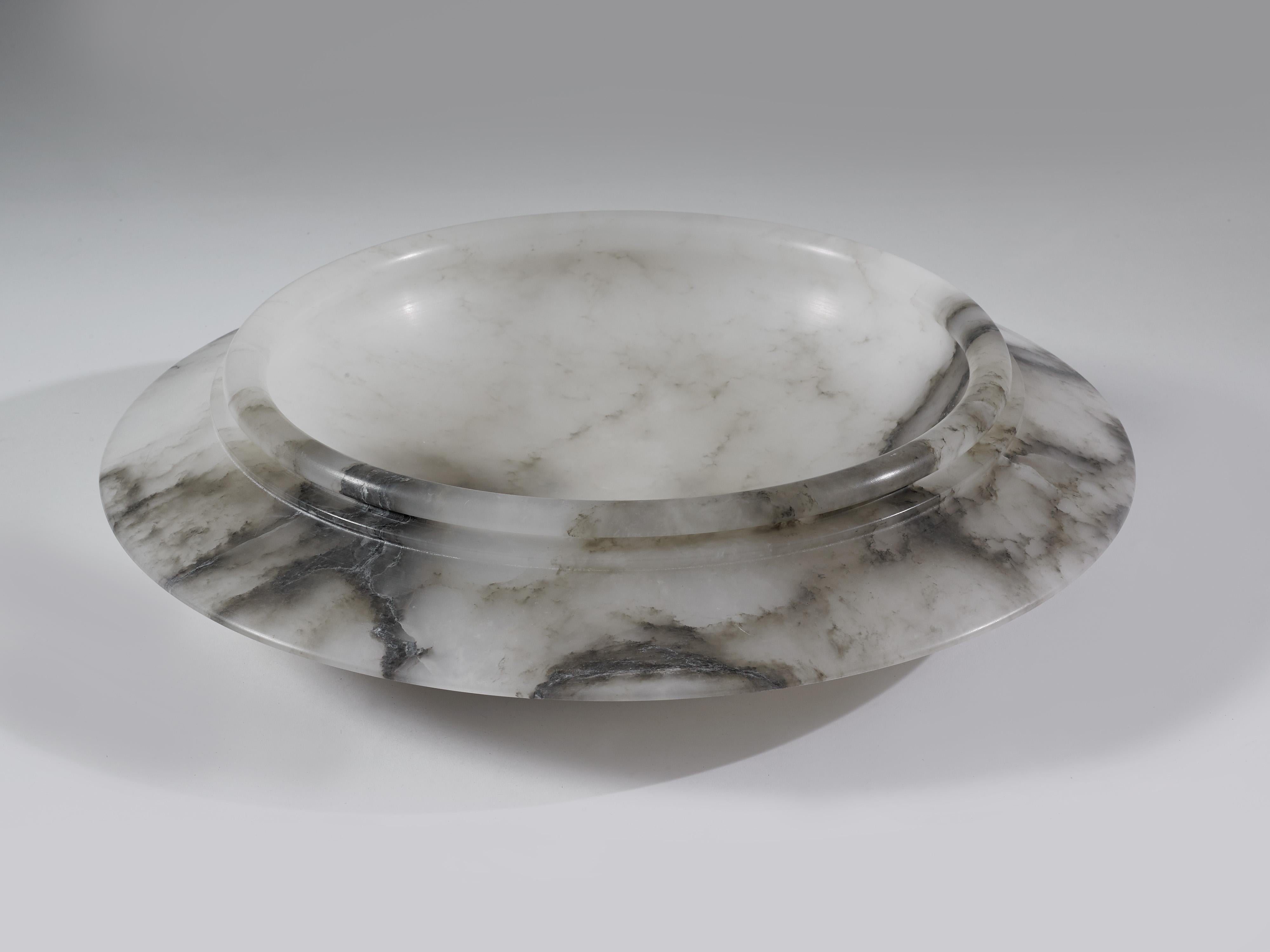 Large white alabaster plate, with a beautiful grey vein, from the hills of Tuscany. Made in 2019, for Urban Art.

This handsome piece makes a beautiful center piece for a dinning room, as alabaster is much lighter than stone or marble, making it a
