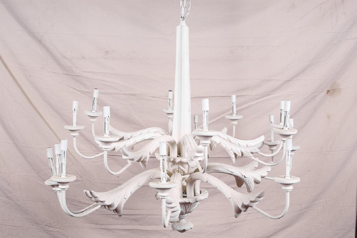 Large white two-tiered leafy 16 light chandelier, white composition with two tiers of scrolled acanthus leaf arms with a leafy urn on the standard and one as the terminal. 

Condition: Gently used condition with light signs of wear.