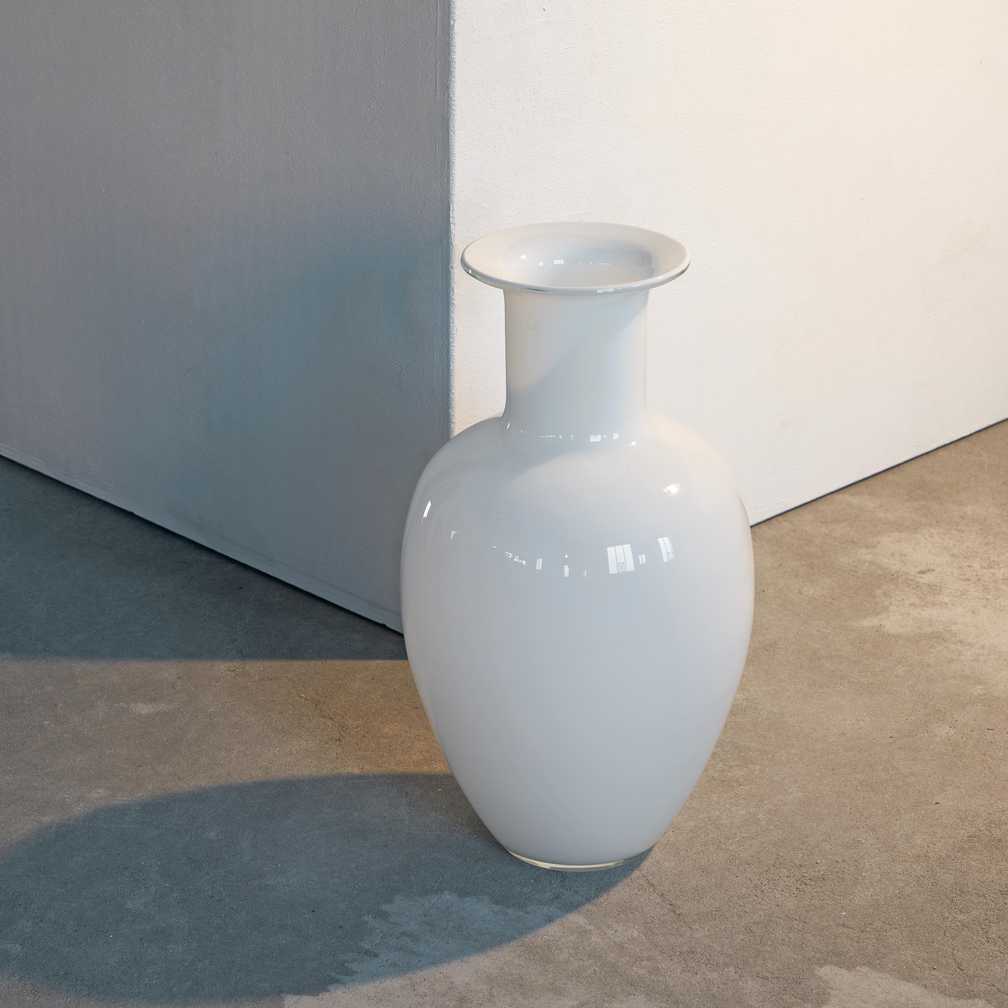 Beautiful large Murano vase in opaline glass by Venice glass maker Vistosi. 1970s, Italy.

Due to the size and appearance of this striking white vase, this is a piece suitable for any stylish interior. The shape is really well proportioned and