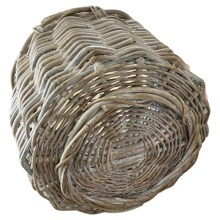 White washed round rustic basket constructed from woven wicker reeds with handles on each end. Perfect for decorating and display. These are great for firewood, pool towels, laundry, and just about anywhere you need a beautiful generous collect-all