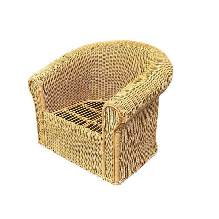A beautiful large Hollywood Regency wicker, bamboo, and rattan lounge chair. A perfect piece for a covered patio or garden, or even in a living room to bring a pop of the outdoors inside. This piece was created in the manner of Michael Taylor and