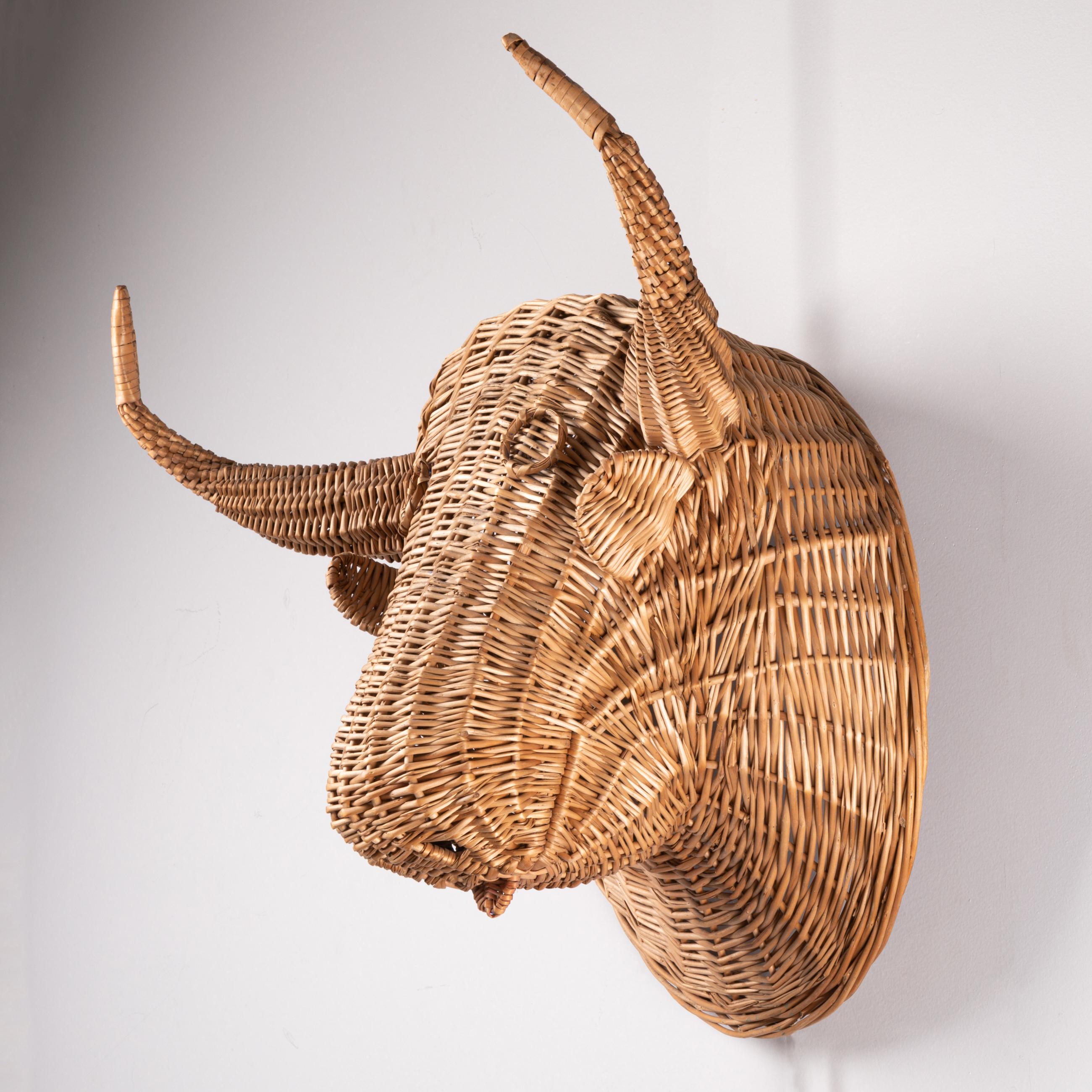 Wicker bull's head.
This type of wall decoration have been produced (in Esparto or Wicker) in Spain but also in the South of France.
circa 1970.

Measures: height : 52 cm / 20,47 cm 
Width : 50 cm /19,68 inch 
Depth : 30 cm / 11,81 inch.