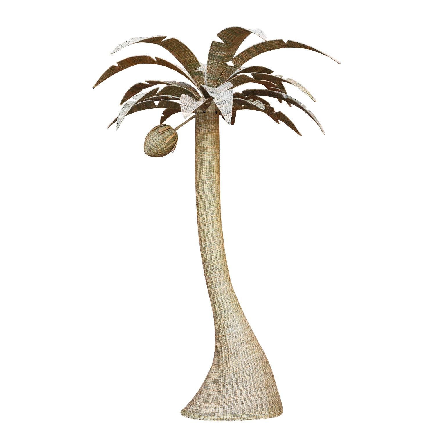 Large wicker palm tree crafted with a sturdy metal frame ambitiously wrapped in reed, exclusively designed and offered by F. S. Henemader Antiques, as part of the Flores Collection. Removeable leaves for easy shipping. 2 available.