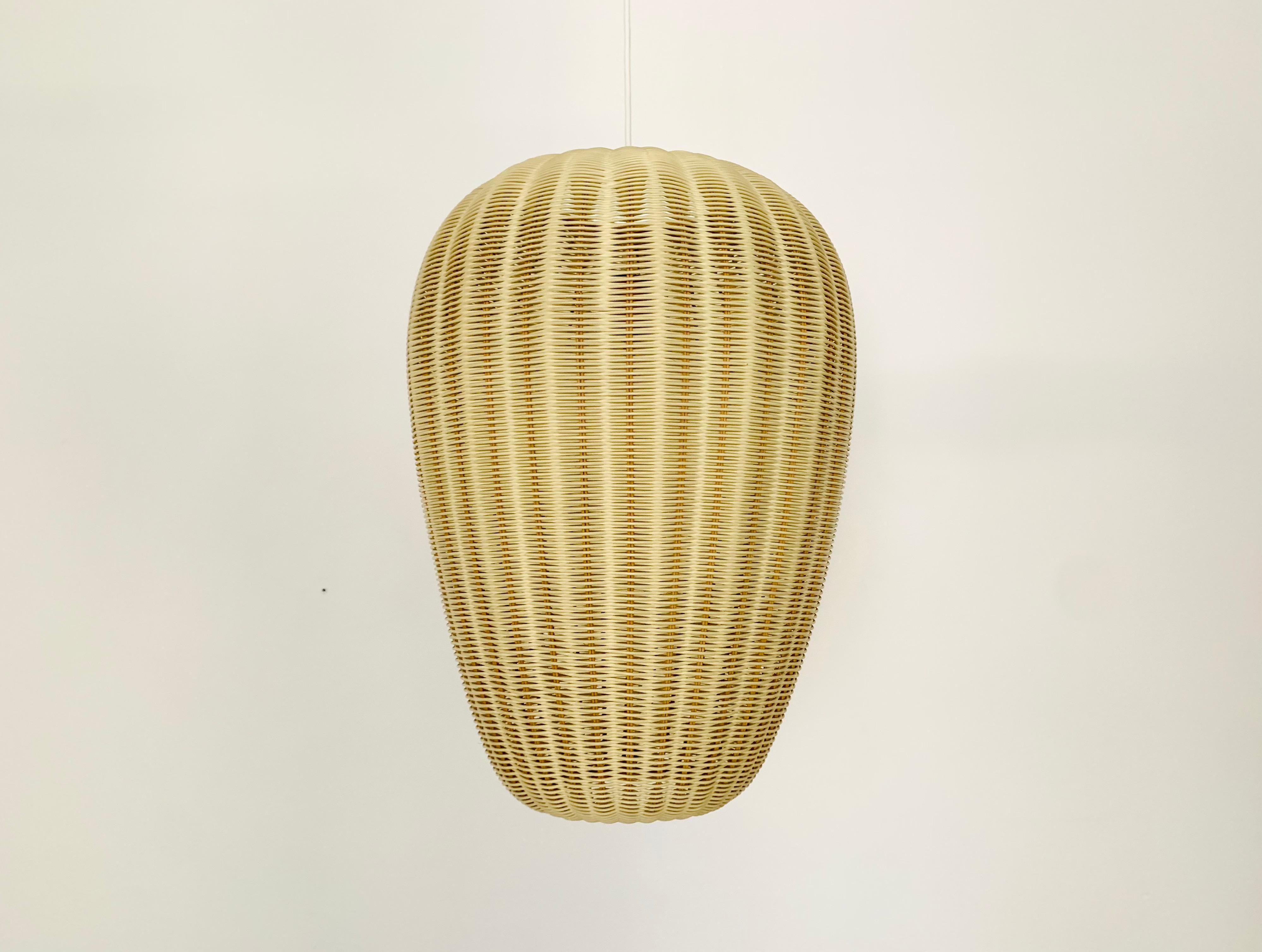 Beautiful and very large pendant lamp from the 1950s.
Great and unusual design with a fantastically comfortable look.
Very high quality workmanship.
A spectacular play of light is created.

Condition:

Very good vintage condition with slight signs