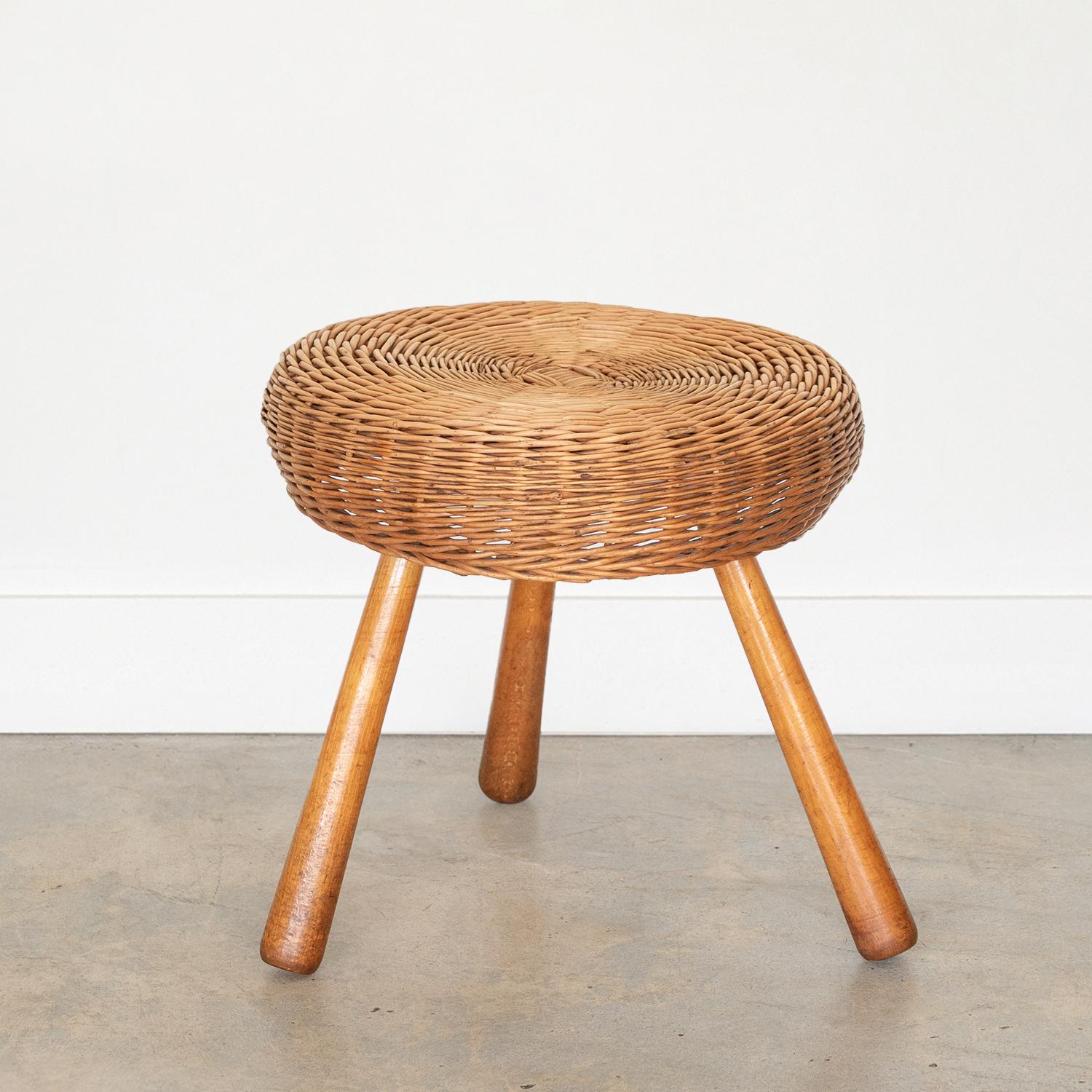 Incredible large 1950s circular wicker stool by Tony Paul. Original circular wicker top with three wood legs showing nice age and patina.