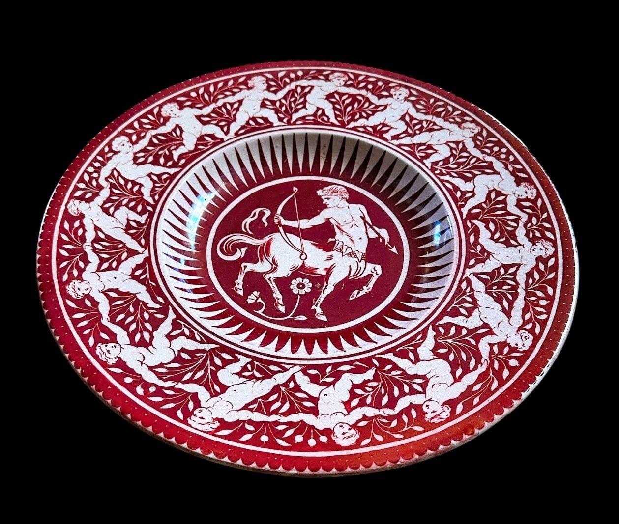 5483
Large Ruby Lustre William De Morgan Charger decorated with a Central Cenatour with a Border of Dancing Putti
Light scratches and some glaze irregularities
Similar Designs Illustrated in Martin Greenwood’s “The Designs of William De Morgan” Page
