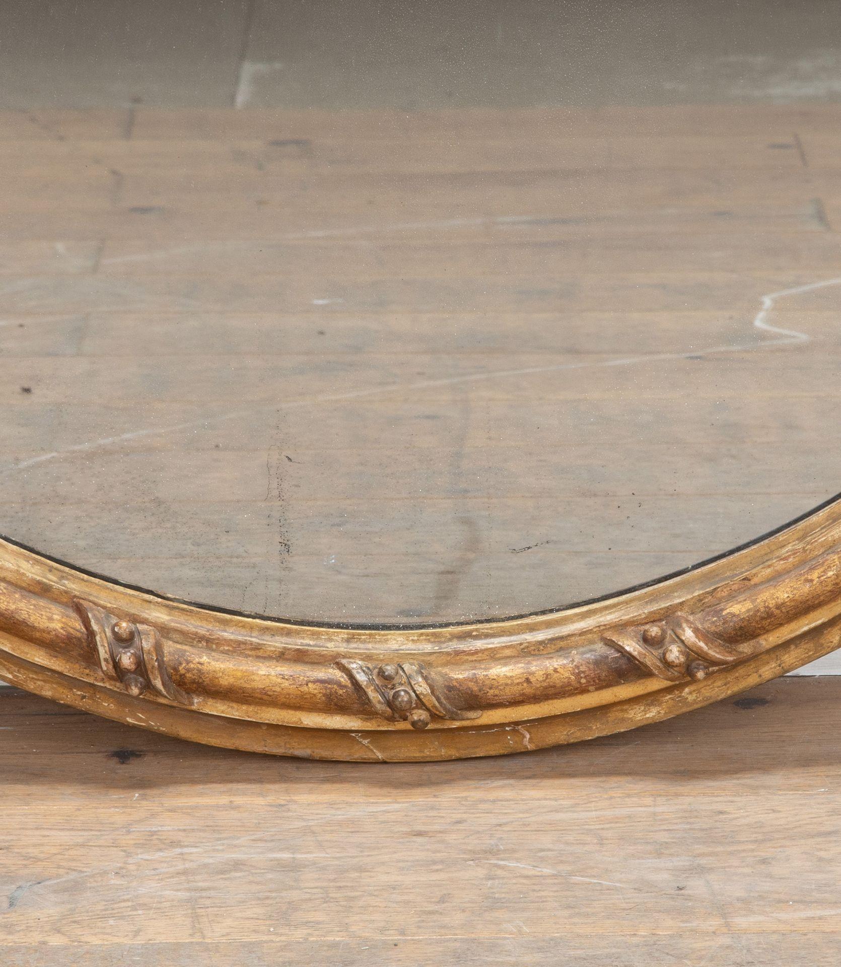 A fine English, William IV period, giltwood oval mirror.
Retaining its original gilding and sparkly mercury plate.
Circa 1830.