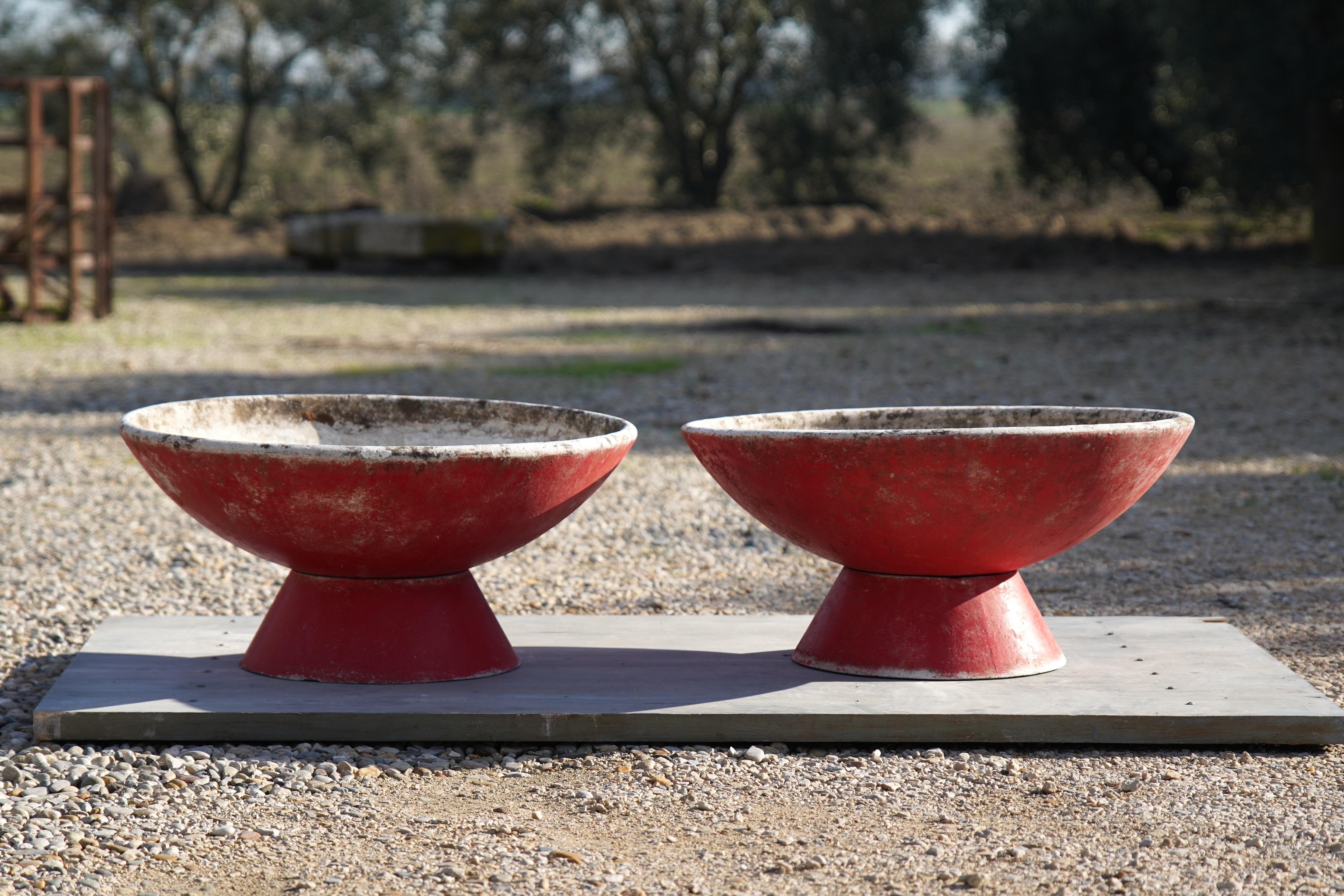 Wonderful cement bowl planters designed by Willy Guhl for Eternit in Switzerland circa 1960s.

The bowl can be angled a multitude of ways due to it being a separate entity from the base allowing plants to trail if wished. The base can also be