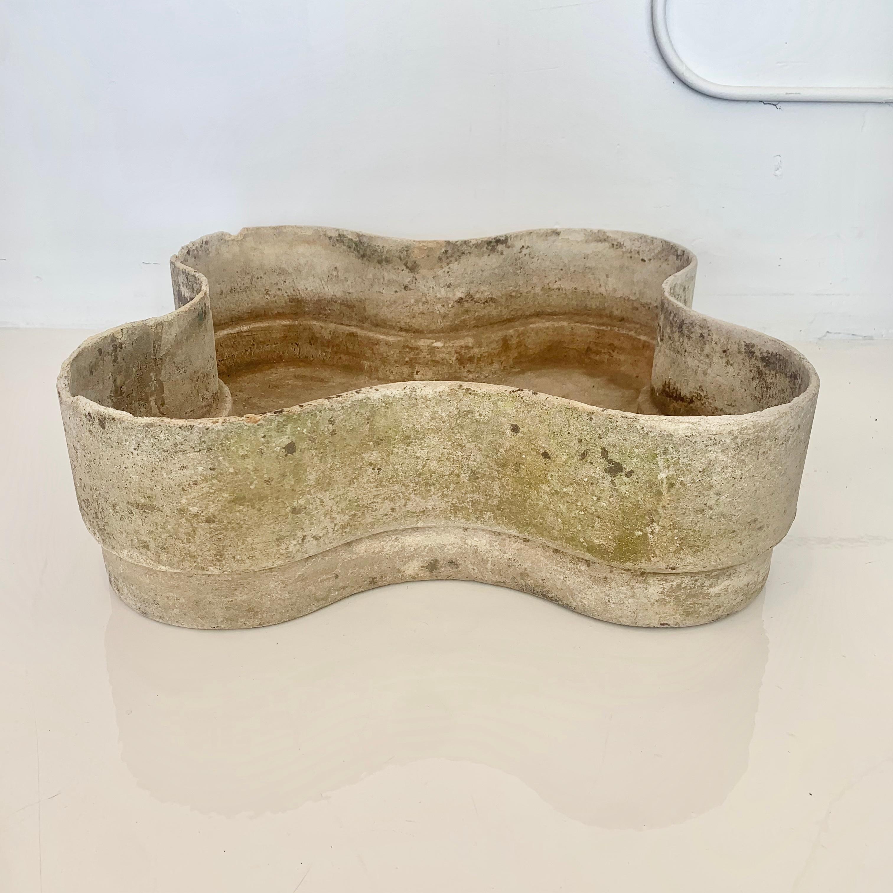 Large scale concrete planter by Swiss architect Willy Guhl. Unique biomorphic shape with four rounded edges. Moss and lichen, with great patina. Great addition to any outdoor space. Good vintage condition with perfect patina. Some losses to the lip