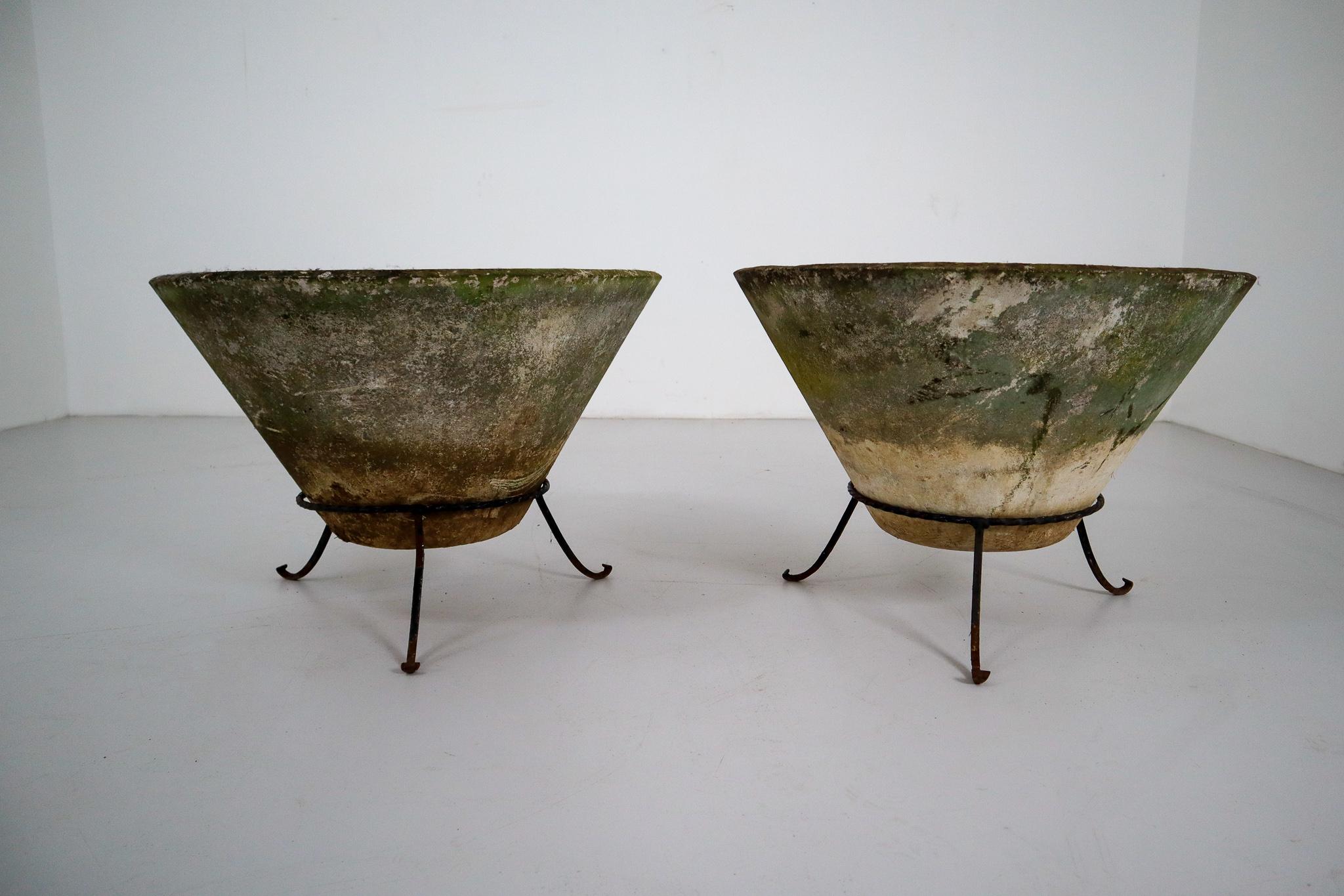 A set of two Mid-Century Modern large saucer planters of composition stone for an indoor or outdoor garden, garden room, or terrace, designed by the iconic Willy Guhl in the early 1960s. They have a lovely naturally-weathered surface.
