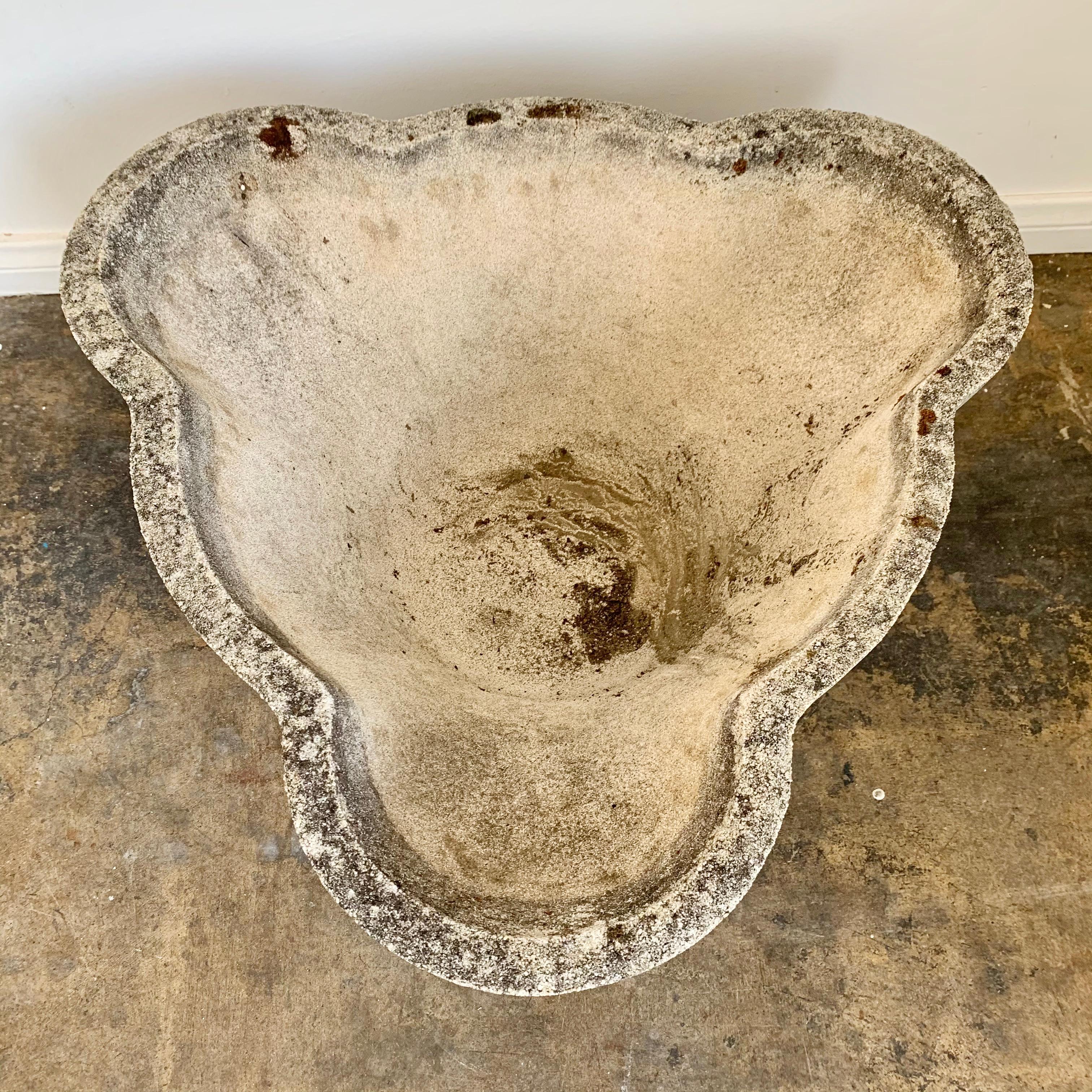 Large unusual scalloped concrete planters by Swiss architect Willy Guhl. Three rounded edges on all sides. Moss and lichen, with great patina. Two still available in this size. Very heavy.

   



  