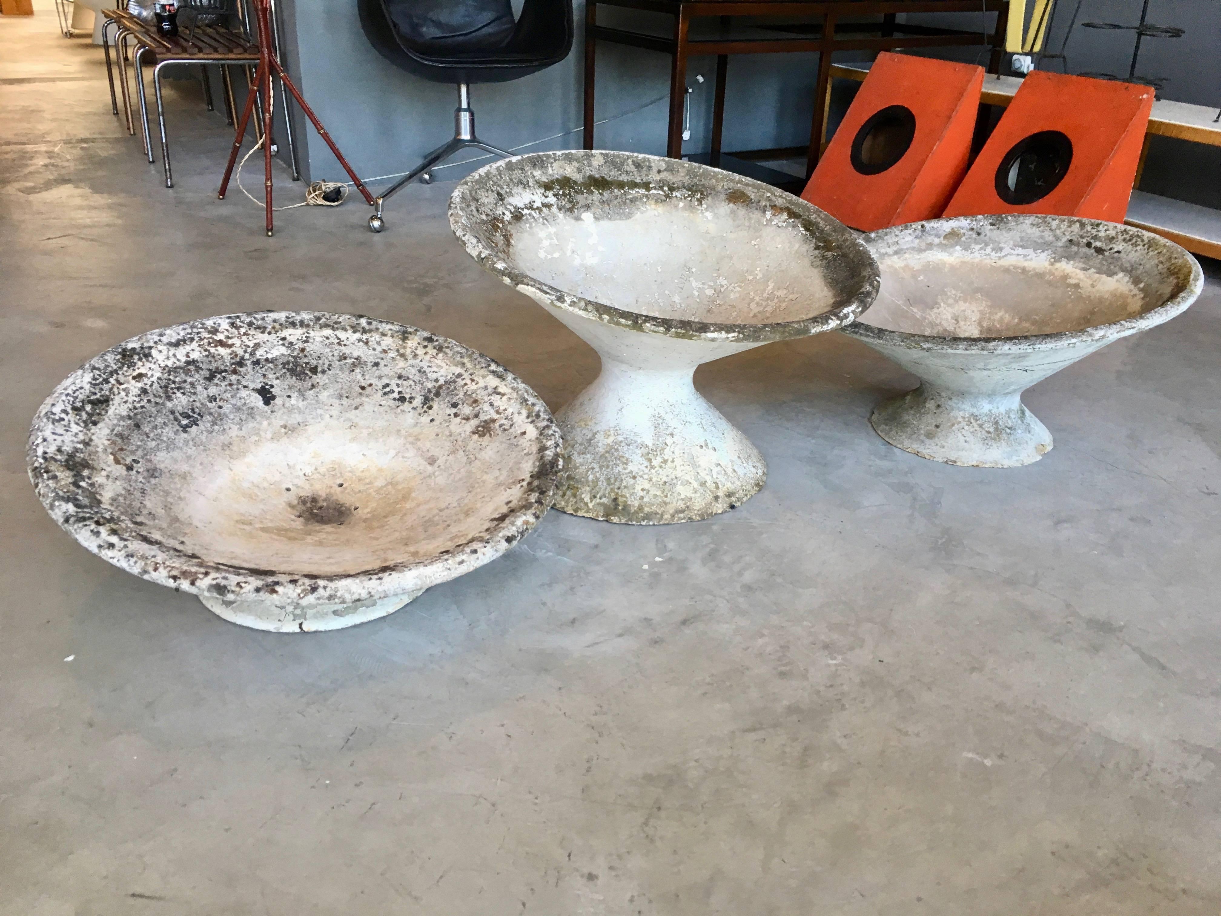 Large tilted concrete planters by Swiss Architect Willy Guhl. Great patina and coloring to each planter. Excellent vintage condition. Great planter and standalone sculpture for indoors or outside. 8 available in this height.

Short and medium