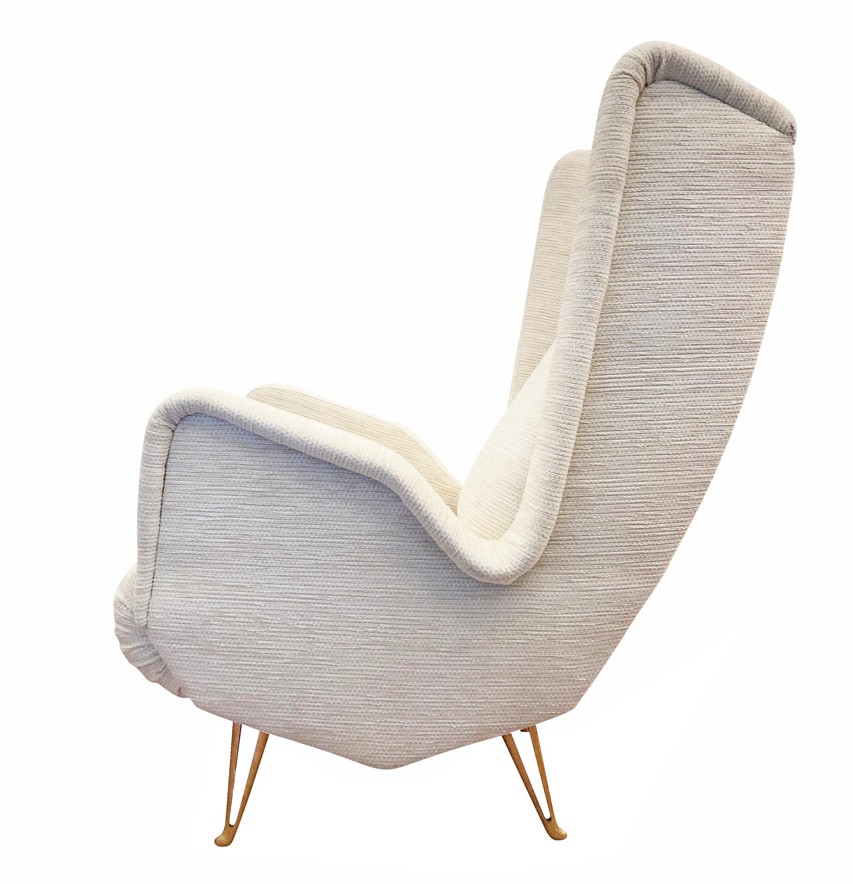 Large midcentury lounge chair manufactured by ISA Bergamo with wings and unusually contoured sides. The legs are gold lacquered aluminium. Re-upholstered in an off-white fabric. 

Condition: Recently re-recovered. Legs are in original vintage
