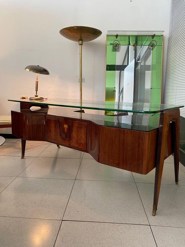 Large wood and brass desk by Vittorio Dassi, Italy, 1950s

Large Mid-Century Wood and Brass desk by Vittorio Dassi, Italy, 1950s

The monumental desk is characterized by its extremely elegant design and the double glass shelf, one transparent in