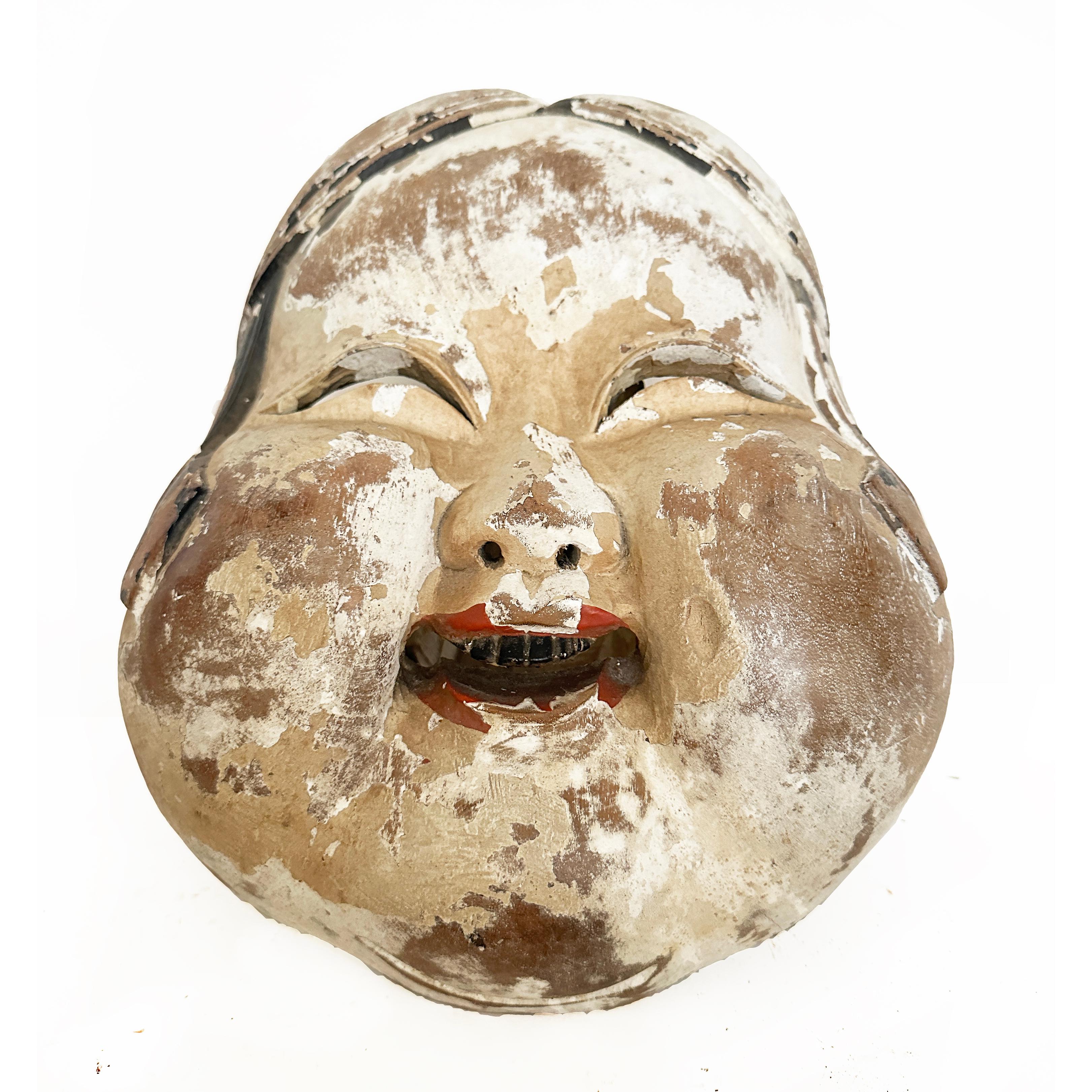Large wood carved Otafuku , Goddess of Mirth, Japanese, 20th Century.

Sometimes known as Okame, a beloved and popular symbol in Japanese culture.  With plump cheeks and joyful smile, the image conveys a generous, kind and goodhearted individual,