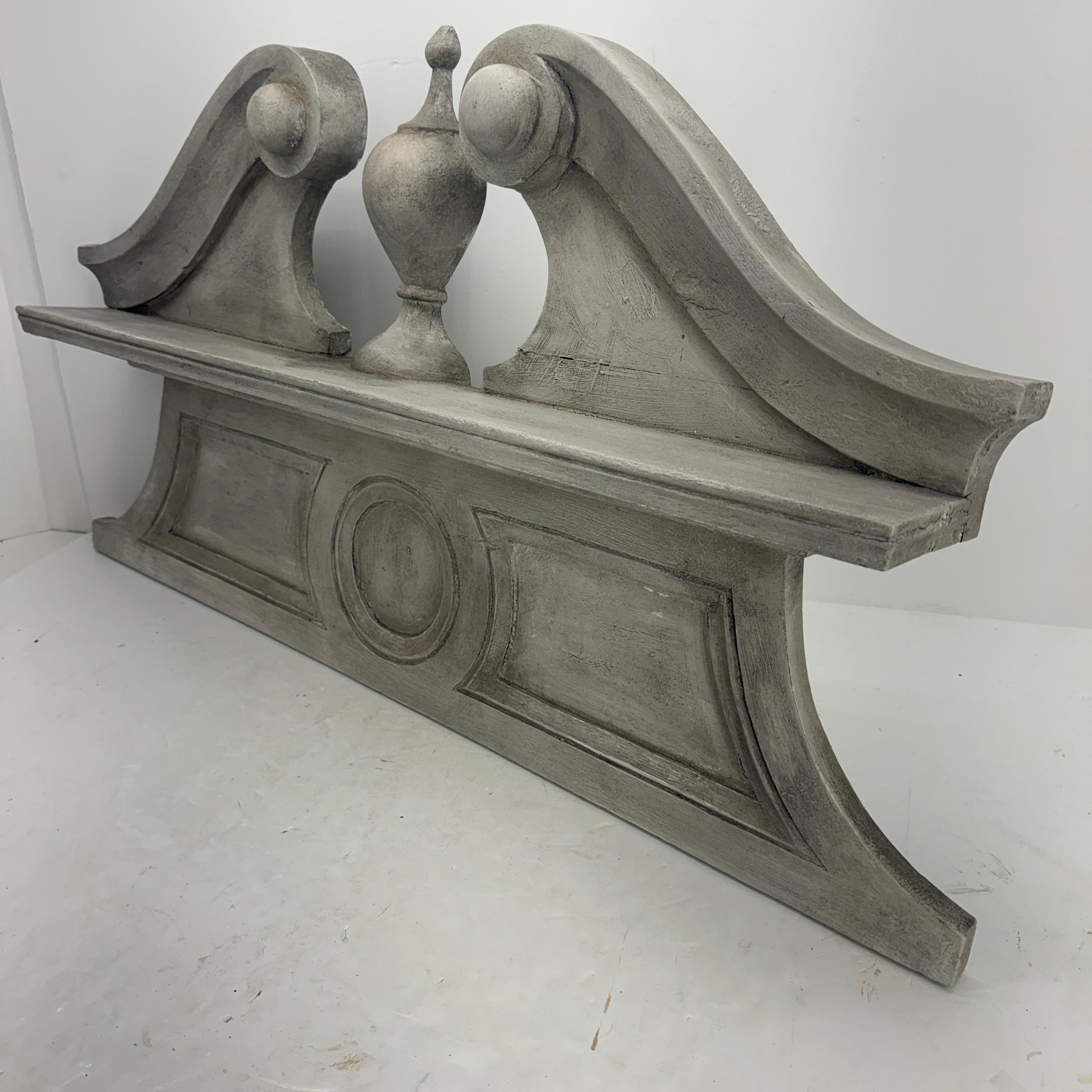 Wooden Painted Carved Architectural Wall Pediment 

This sturdy as well as substantial wall decoration makes an impressive focal piece on a wall seeking a statement. This grey hand-painted element looks fantastic standing alone or displayed you’re
