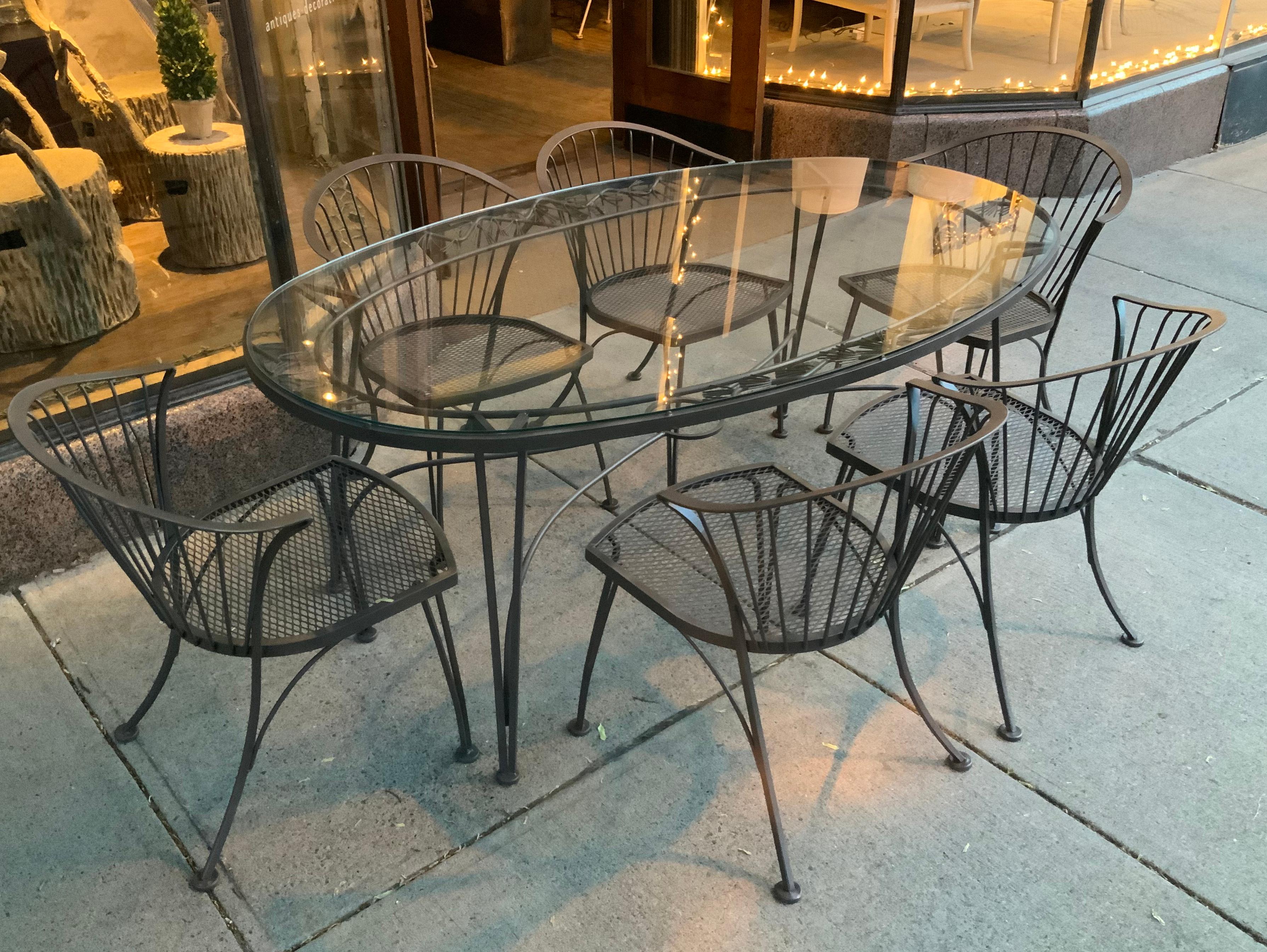 wrought iron oval table and chairs