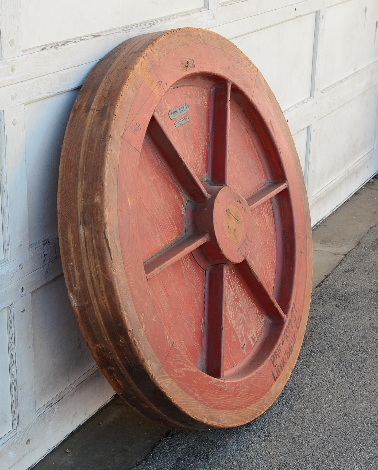 Large wheel form foundry pattern made by Linkbelt. This has wear to the paint and the wood. The back side spokes are missing.