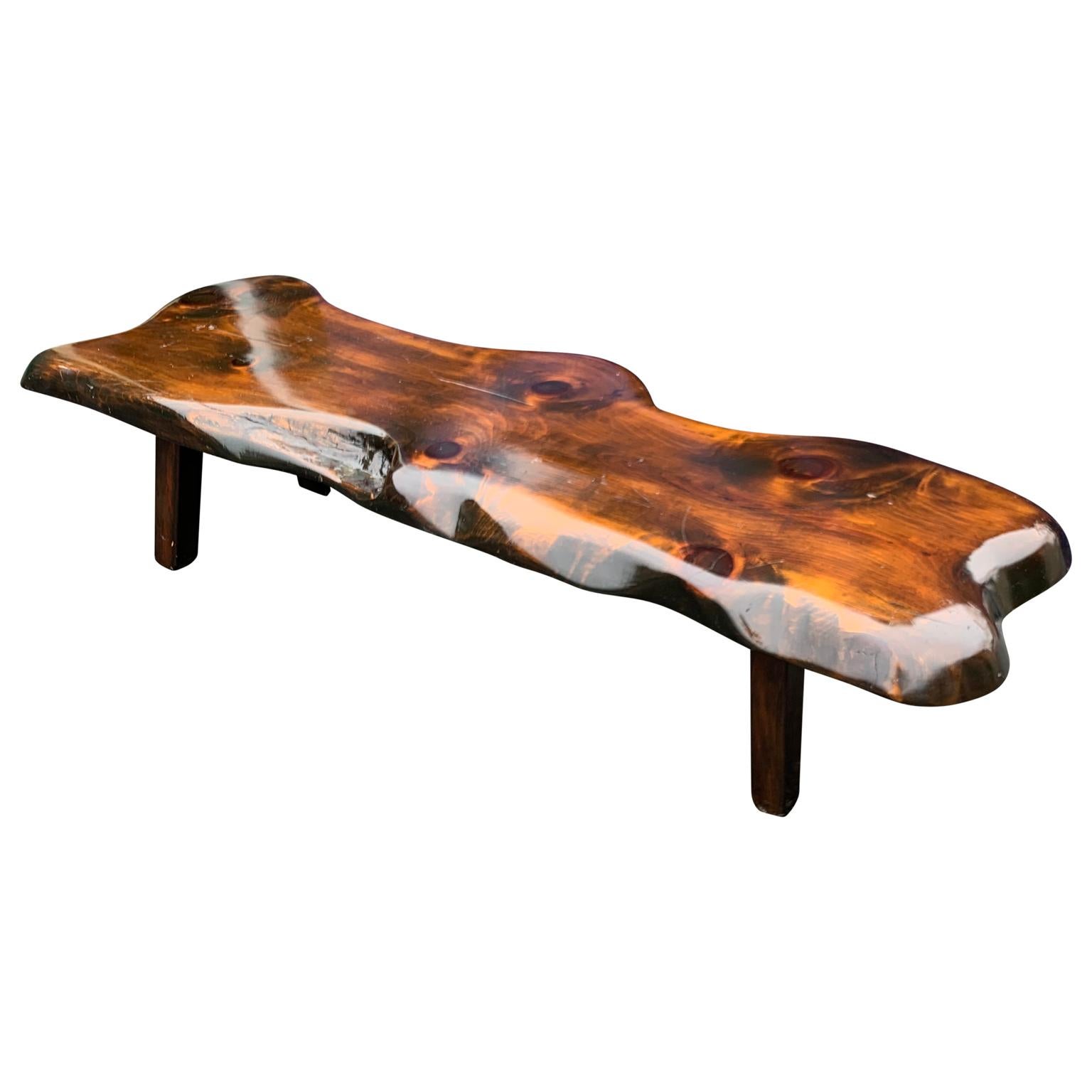 Large wooden folk art bench or cocktail table.