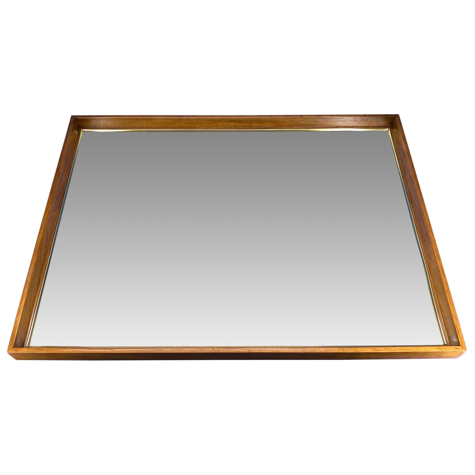 large rectangular wood framed mirror