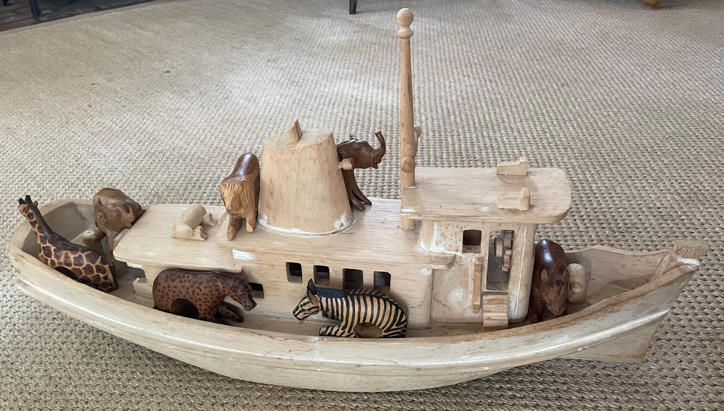 Large wooden tugboat. Hand carved wooden tugboat. United States, Mid-20th Century. 
Dimensions: 28” W x 8.5” D x 15” to tip of mast

*Set of 12 African Safari toys/napkin rings available at separate listing Ref: LU1084234574282