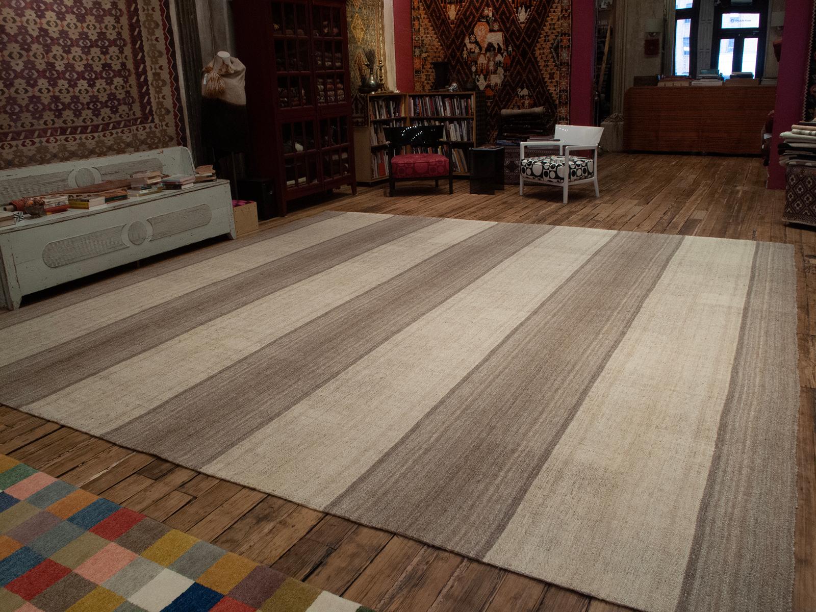 A large tribal flat-woven floor cover from Eastern Turkey. Woven with high quality, local, hand-spun wool in natural (undyed) tones of light brown and beige - soft to the touch, it feels like a heavy blanket. An authentic tribal weaving with great