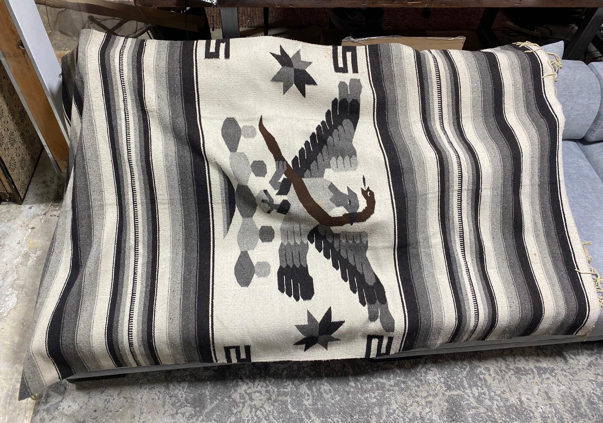 A wonderful large North American Mexican hand-woven Kilim Serape Blanket/Rug featuring a beautiful black, white and grayscale color tone. The piece features the national Mexican icons of the eagle and snake. A fantastic combination of colors and