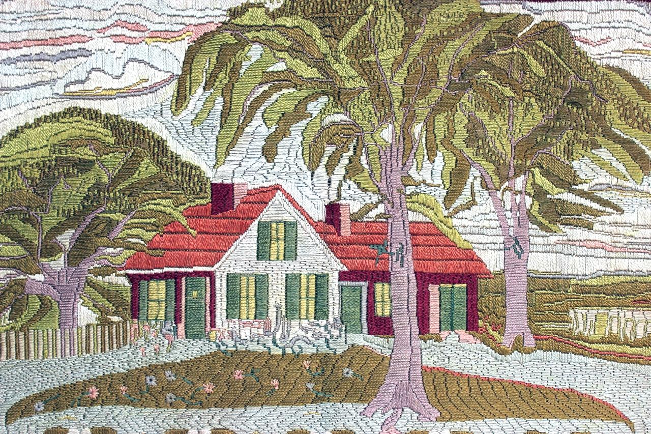 Large woolwork picture of a farmhouse,
First part of the 20th century.

The stunning textile picture, of a large size, depicts a charming house with red roof tiles and green shutters in an exotic landscape with a lush hillside in the background