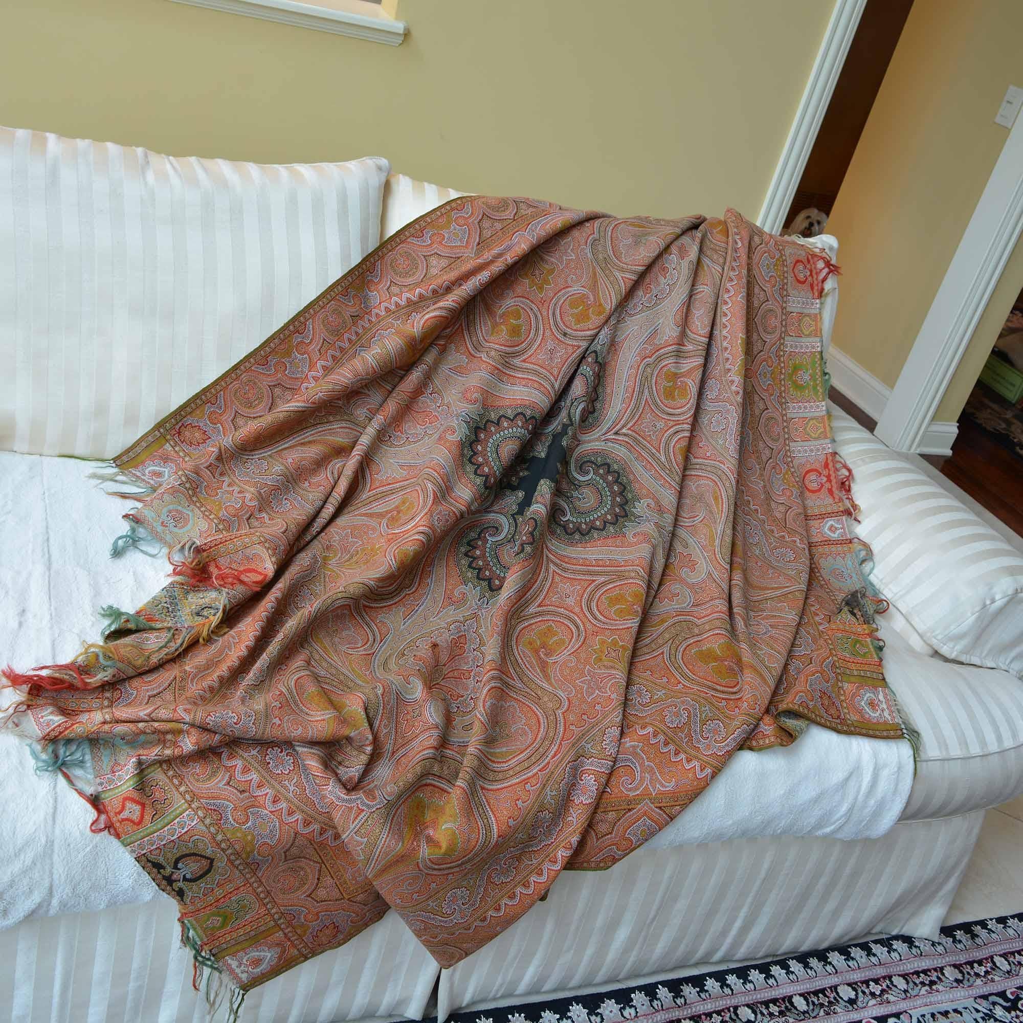 Earth tone, very large silk cashmere paisley throw shawl. We found this beautiful piece in a boutique just outside of Paris that specializes in wonderful finds from estate sales. It is believed to be from the mid to late 1800’s and hand woven. It is
