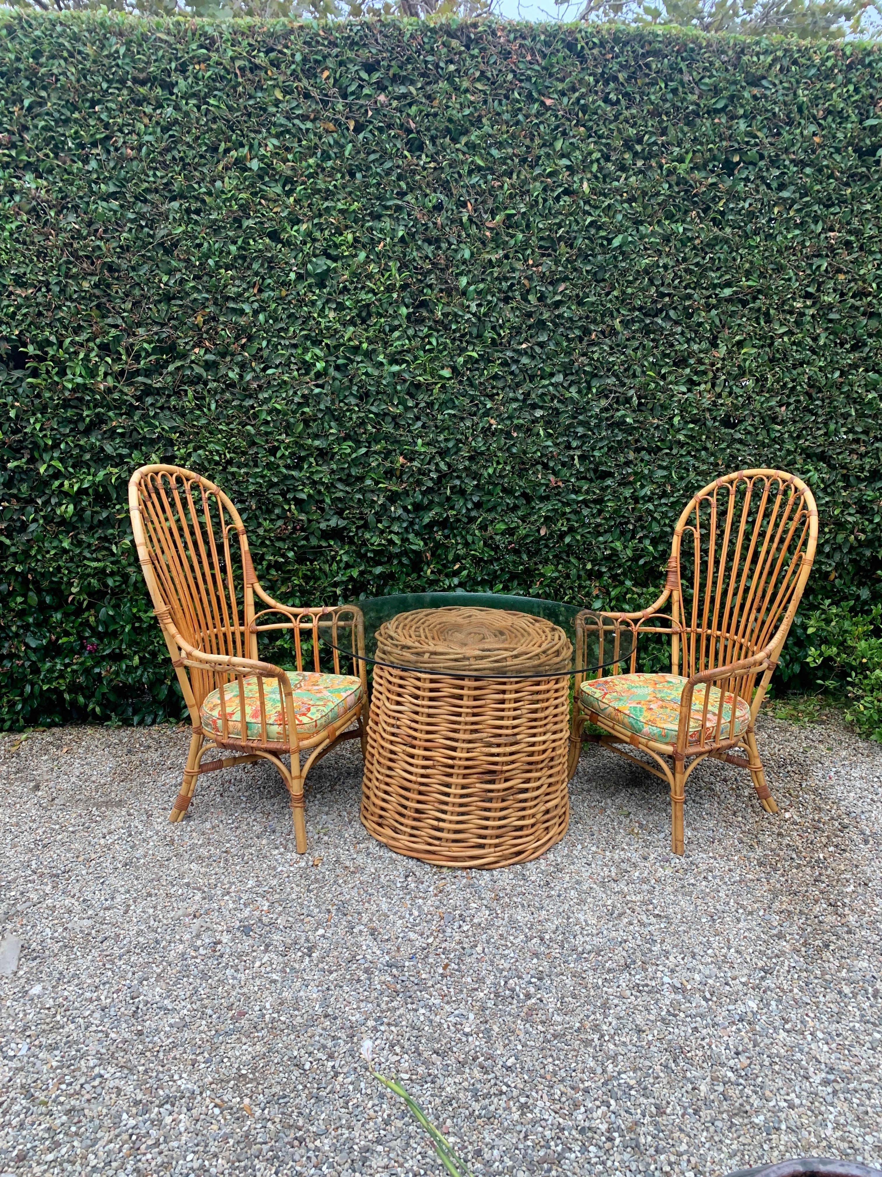 A nicely woven, in very good condition, pencil rattan Base with a glass top. The glass we have used was in our storage , but the base could easily hold any piece of glass up to 50-60