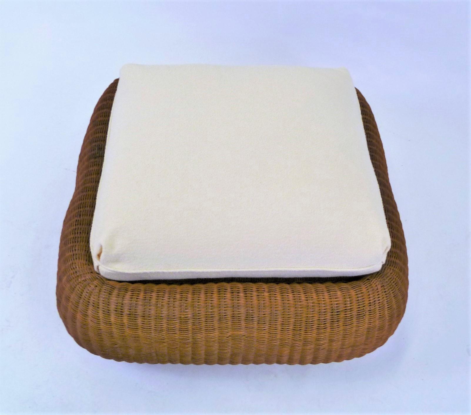 Handwoven rattan ottoman or pouf in the style of Eero Aarnio and his Jutta Jakkara stools. Wonderful rounded form. Cushion with new light cream bouclé upholstery. Great extra seating.
Purchased 1979 from Bloomingdales, NYC.
Measurements: Rattan 30