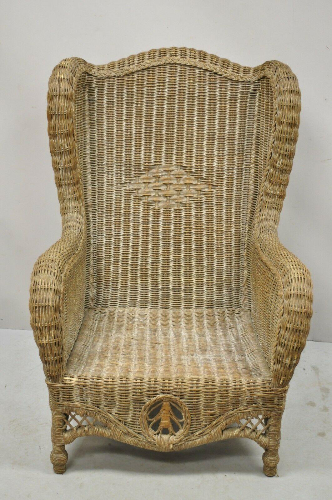 Large Woven Wicker Rattan Victorian Style Wingback Lounge Arm Chair. item features a large Impressive size, woven wicker frame, wingback design, quality craftsmanship, great style and form. Circa Late 20th Century. Measurements: 44