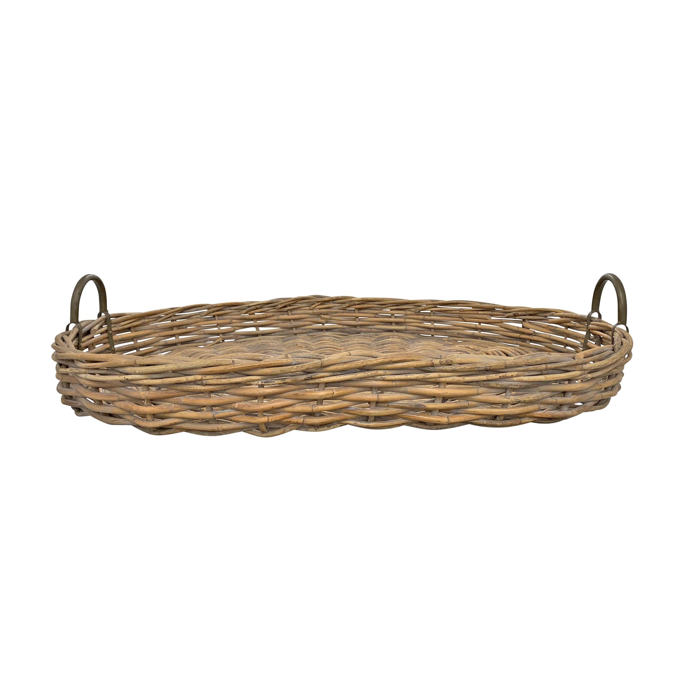 A wonderfully large-scale handwoven oval willow tray with metal handles, perfect for a large ottoman or on a sideboard.