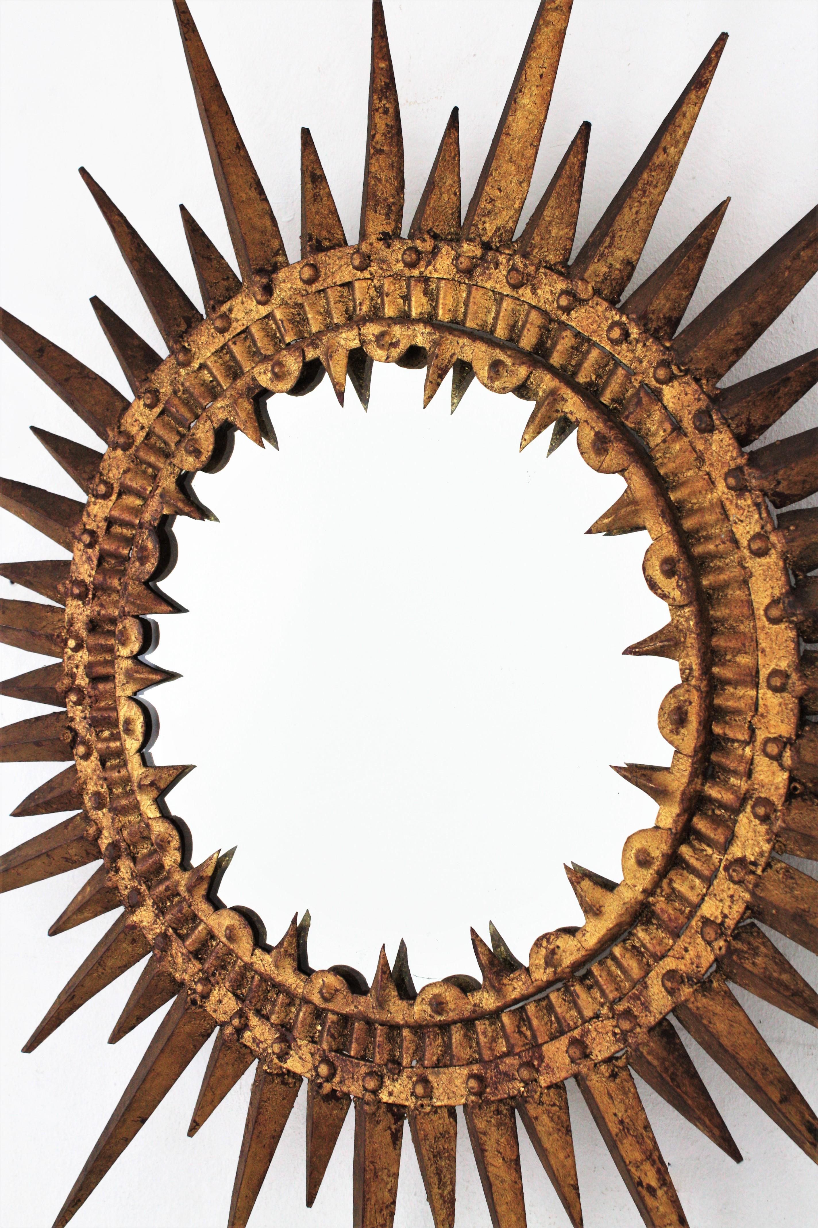 Hammered Spanish Gilt Sunburst Brutalist Mirror, Hand Forged Iron, 1950s For Sale